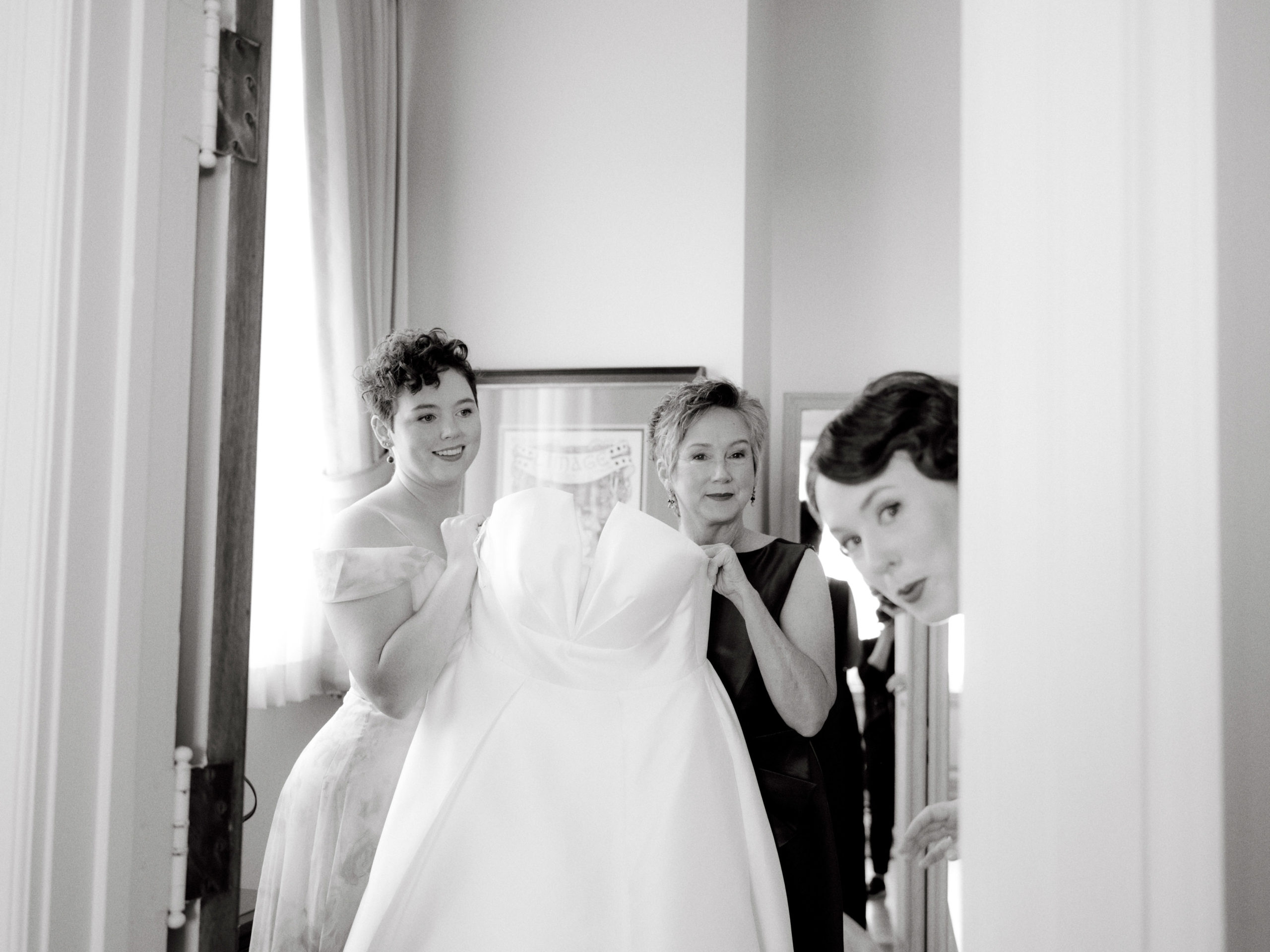 Editorial getting-ready photo with the bride, bride's mother, and bride's sister. Wedding day photo timeline image by Jenny Fu Studio.