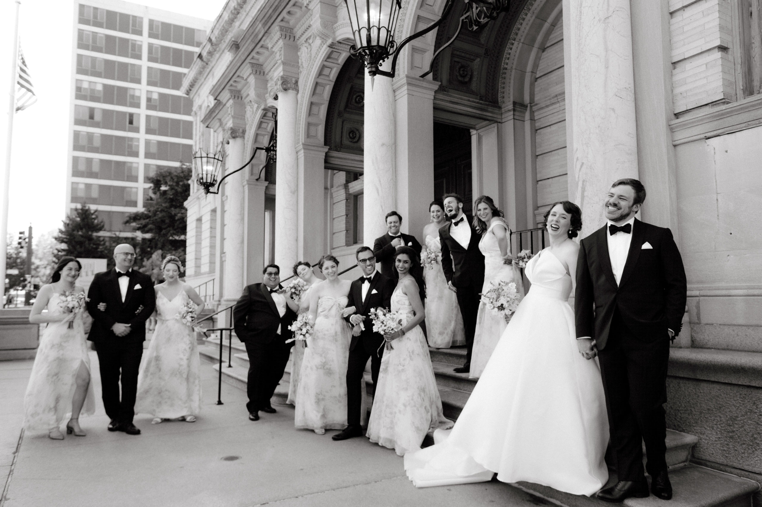 Black and white photo of the couple with the wedding party. Wedding day photo timeline image by Jenny Fu Studio.