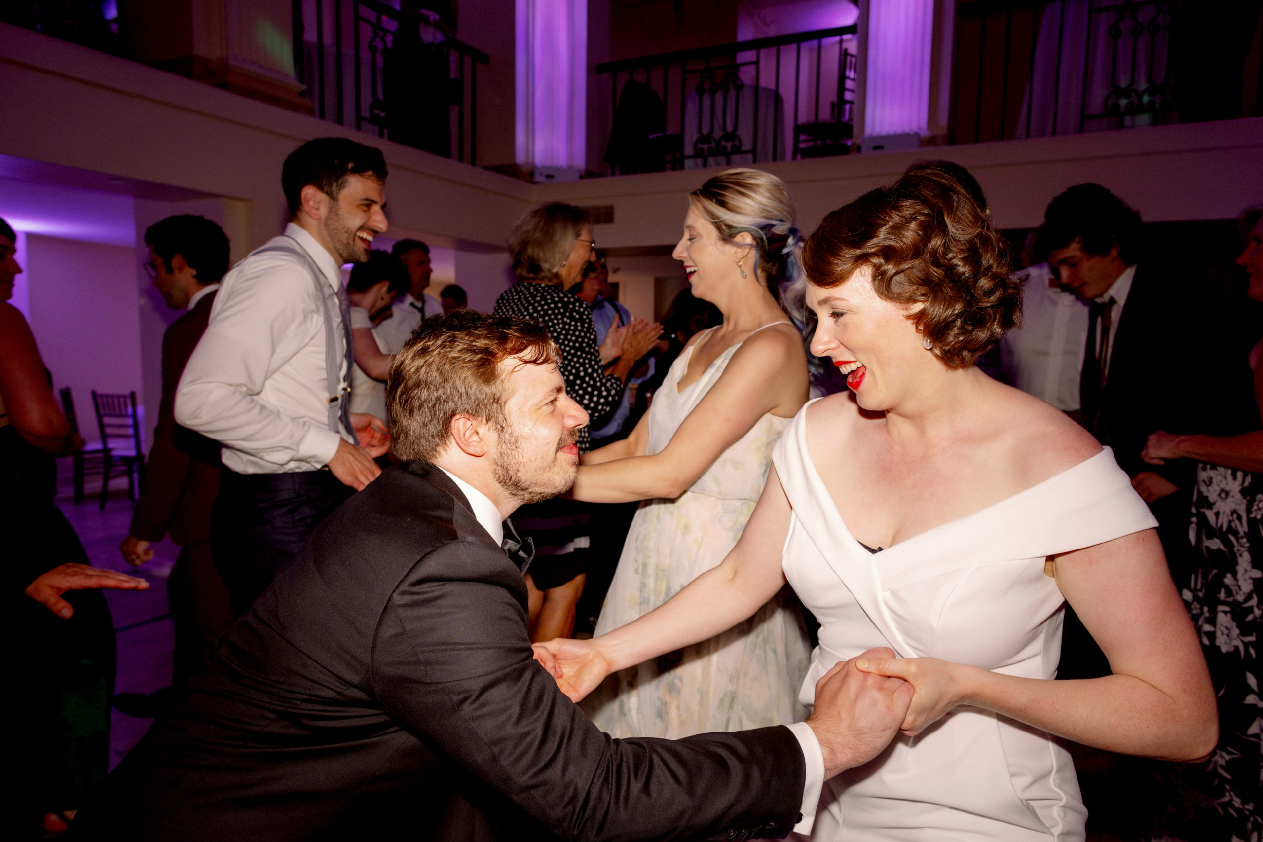 The newly-weds and guests are dancing the night away. Wedding day photo timeline image by Jenny Fu Studio.