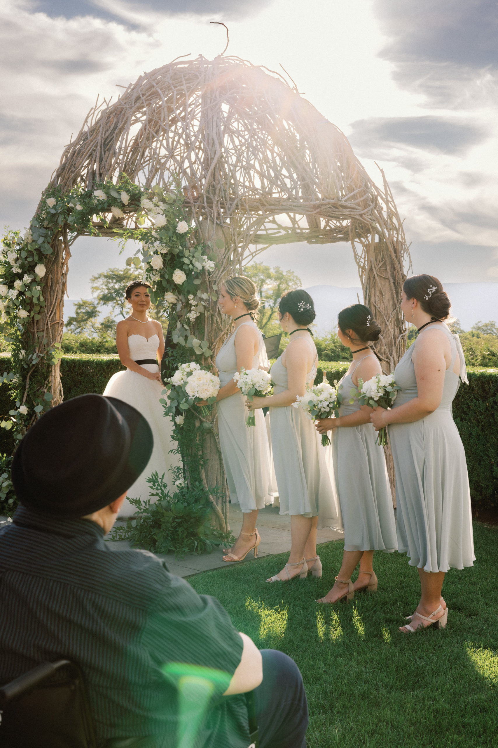 The bridesmaids are lined up for the wedding ceremony. Destination image by Jenny Fu Studio