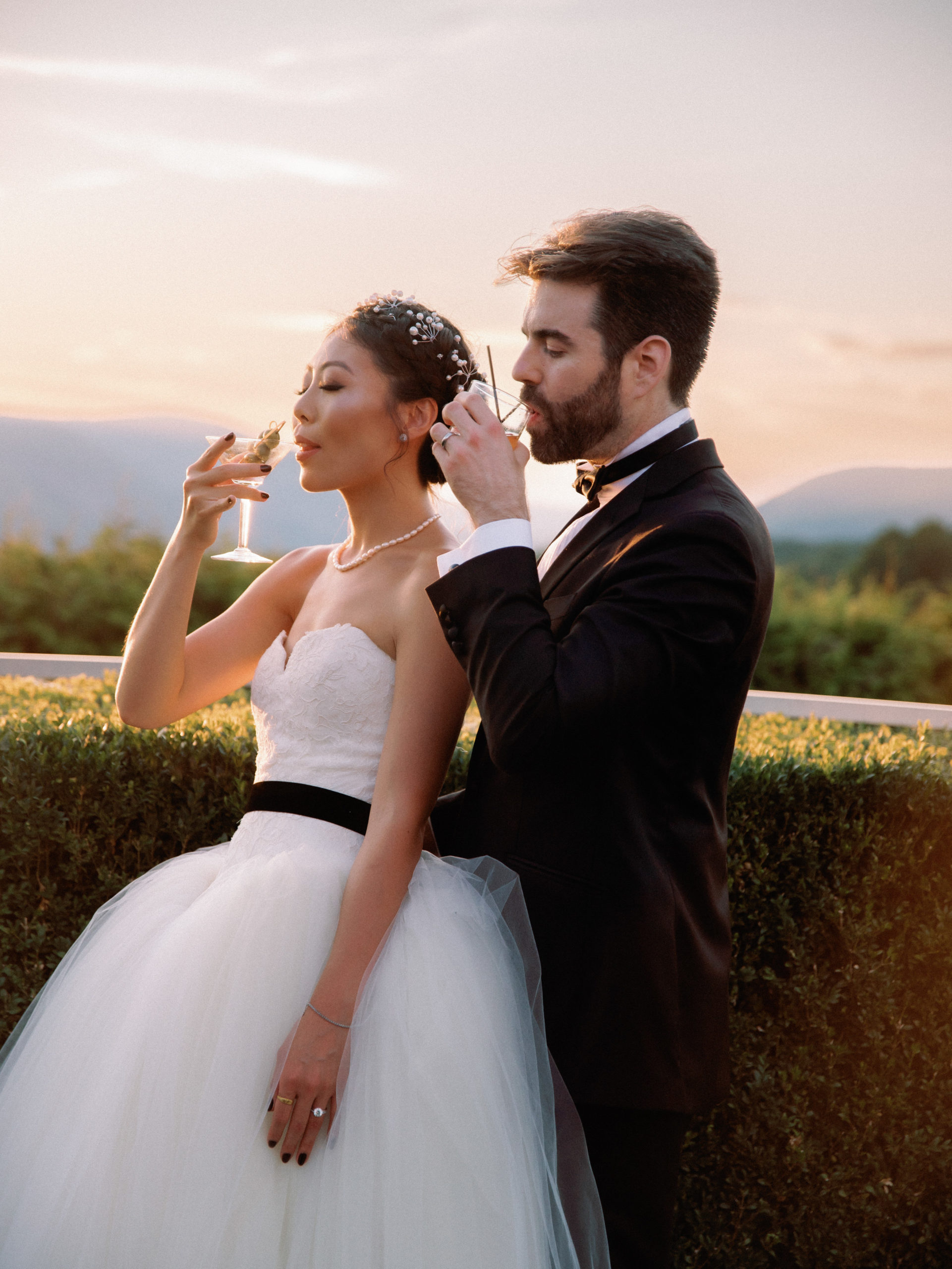 The newlyweds are sipping champagne. Destination wedding rules image by Jenny Fu Studio