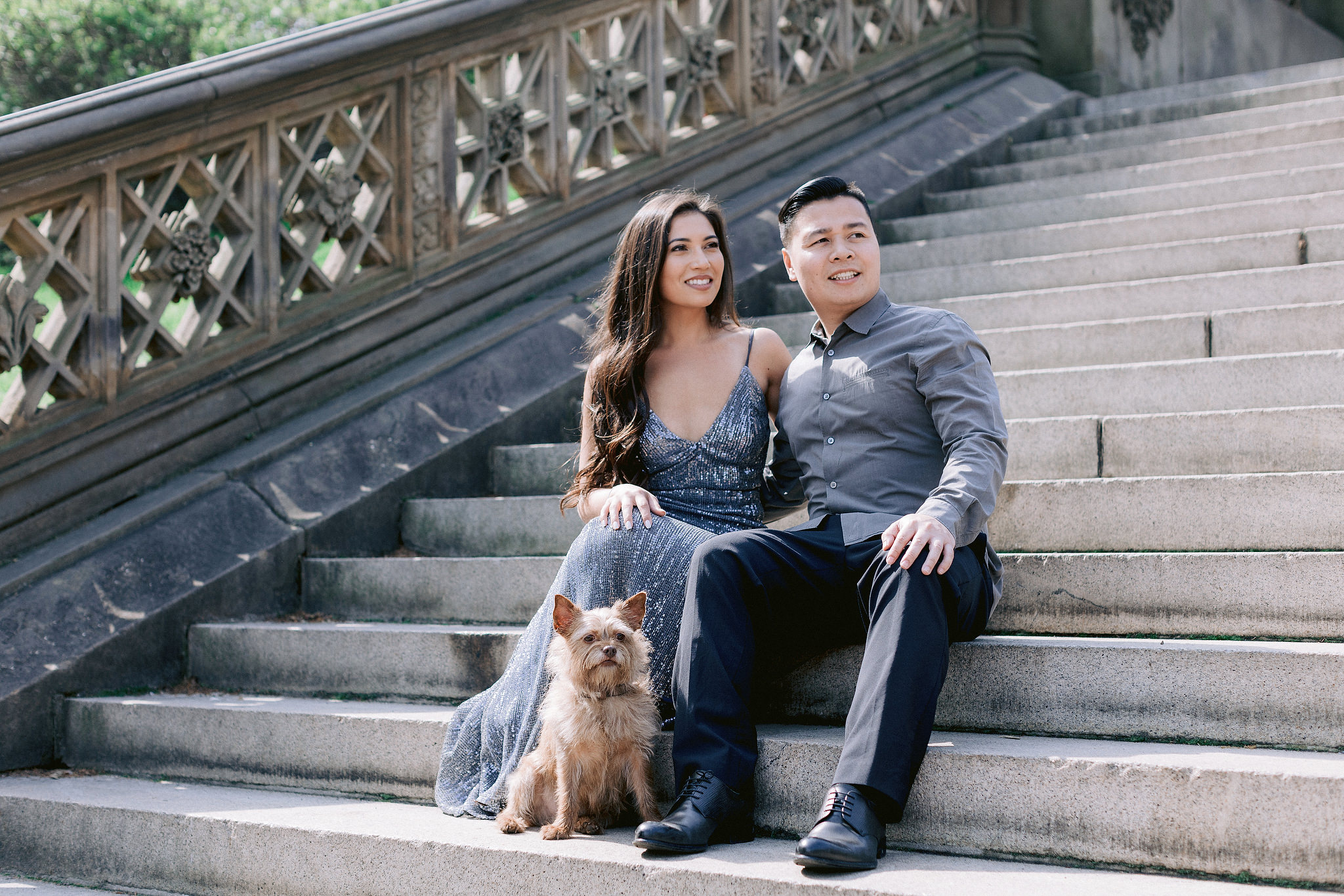 The engaged couple is at NY Central Park with their pet. Engagement session with pets photo by Jenny Fu Studio.