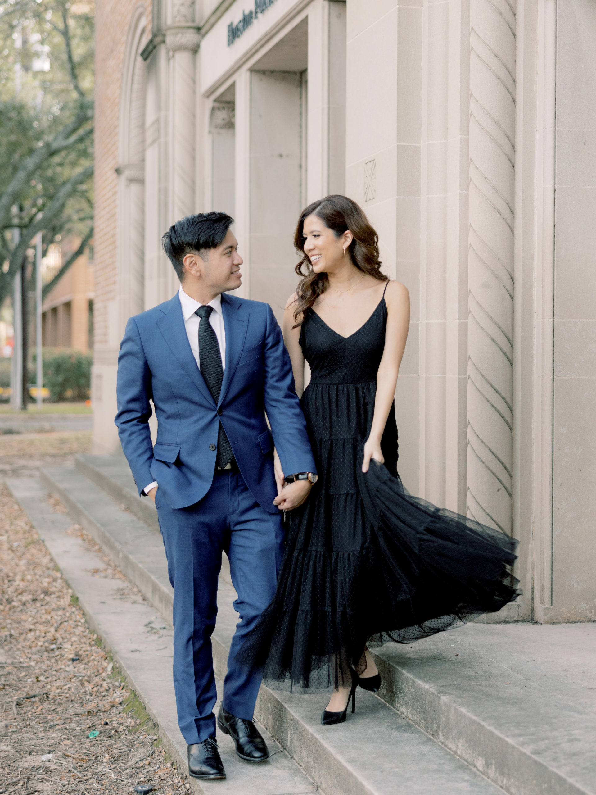 The engaged couple are happily walking while looking at each other. Engagement images by Jenny Fu Studio