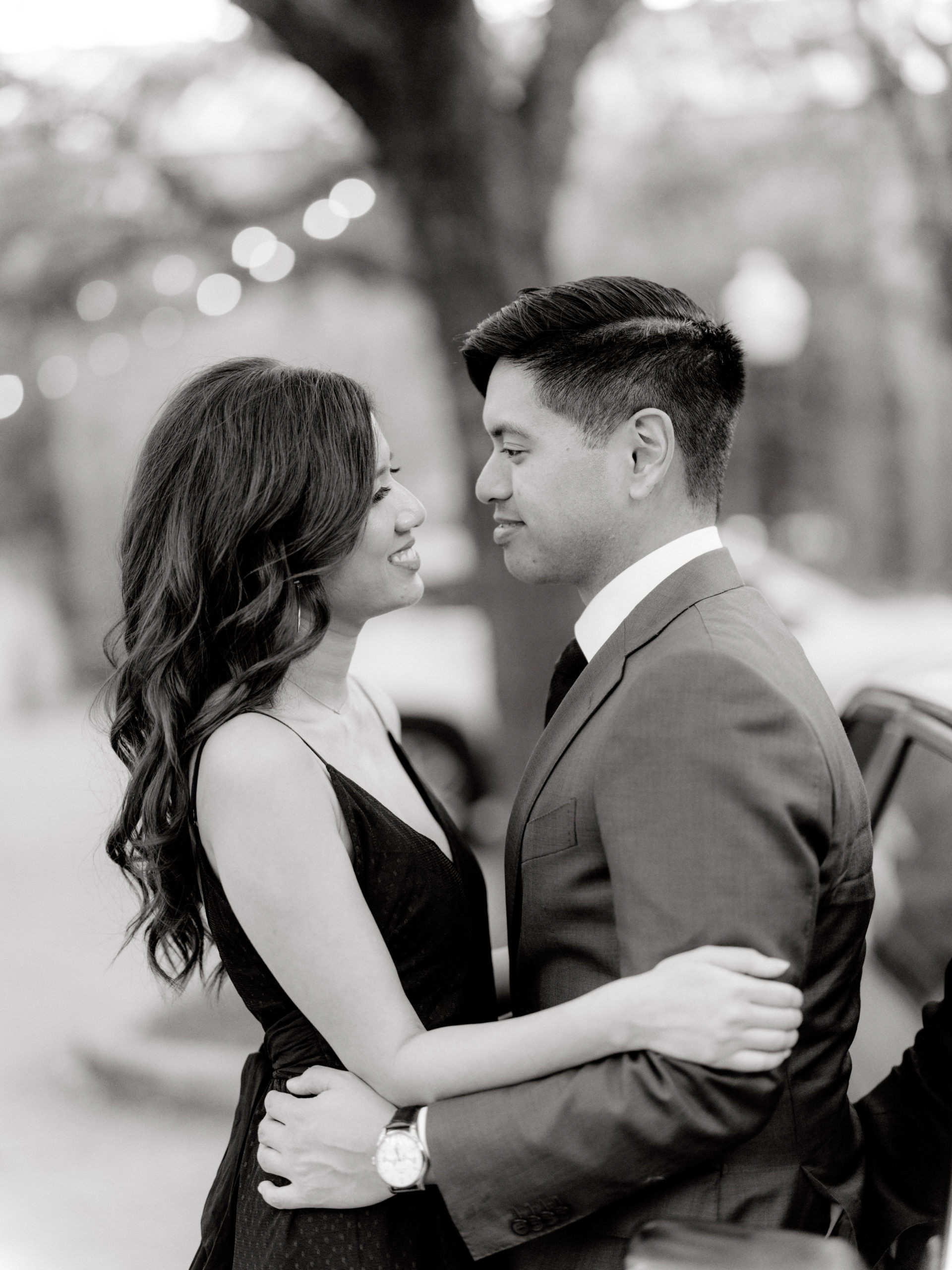 Black and white photo of the engaged couple happily looking at each other. Professional engagement photos by Jenny Fu Studio