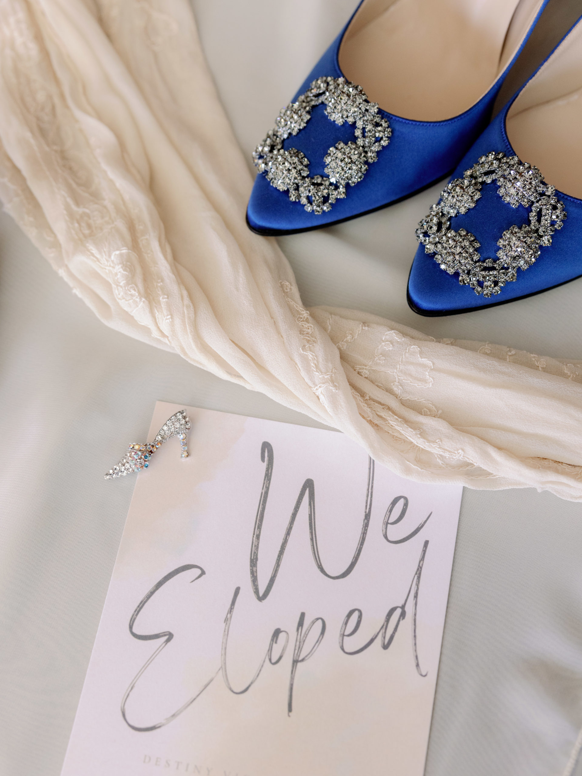 The bride's shoes with a paper that read "We Eloped". Eloping in NYC image by Jenny Fu Studio