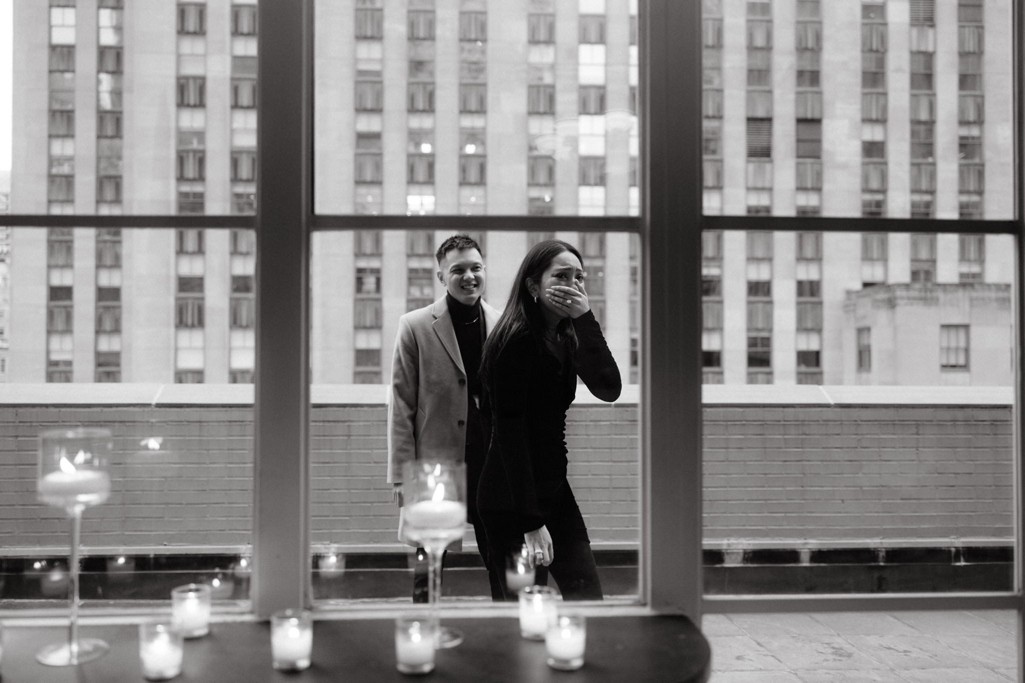 Black and white editorial photo of the emotional woman and her fiancé after the proposal. Image by Jenny Fu Studio