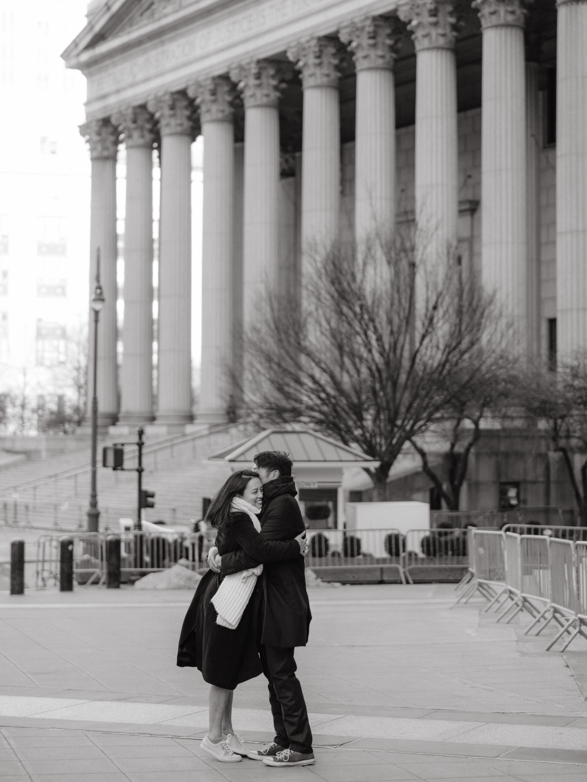 Editorial image of the bride and groom with the NYC City Hall in the background. Image by Jenny Fu Studio