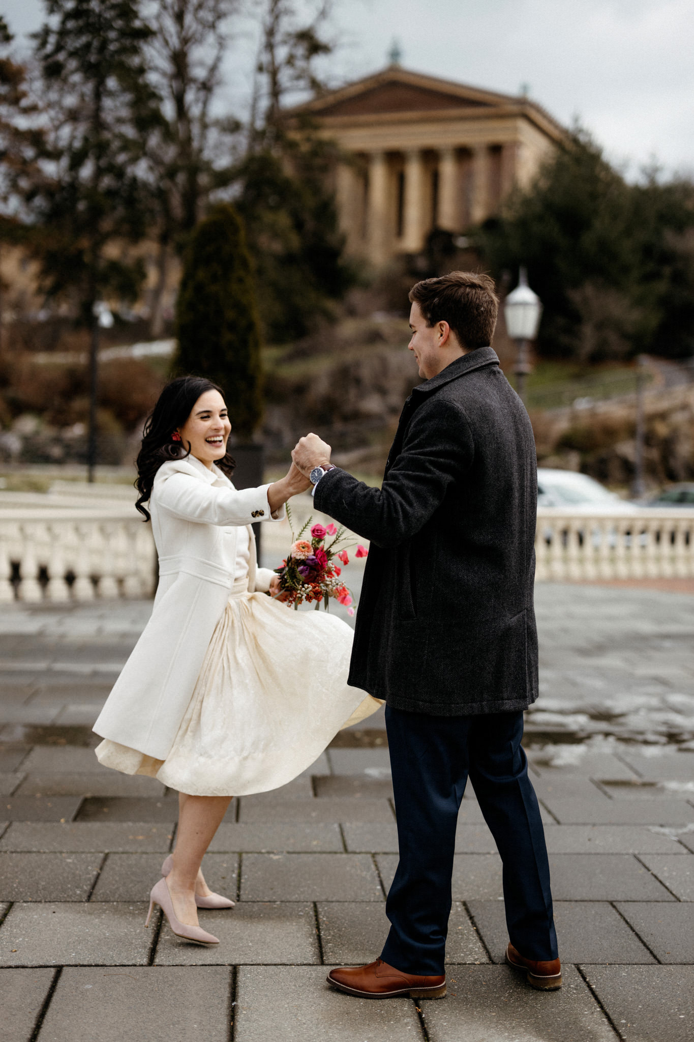 The newly-weds are dancing outdoors. Winter wedding venues image by Jenny Fu Studio