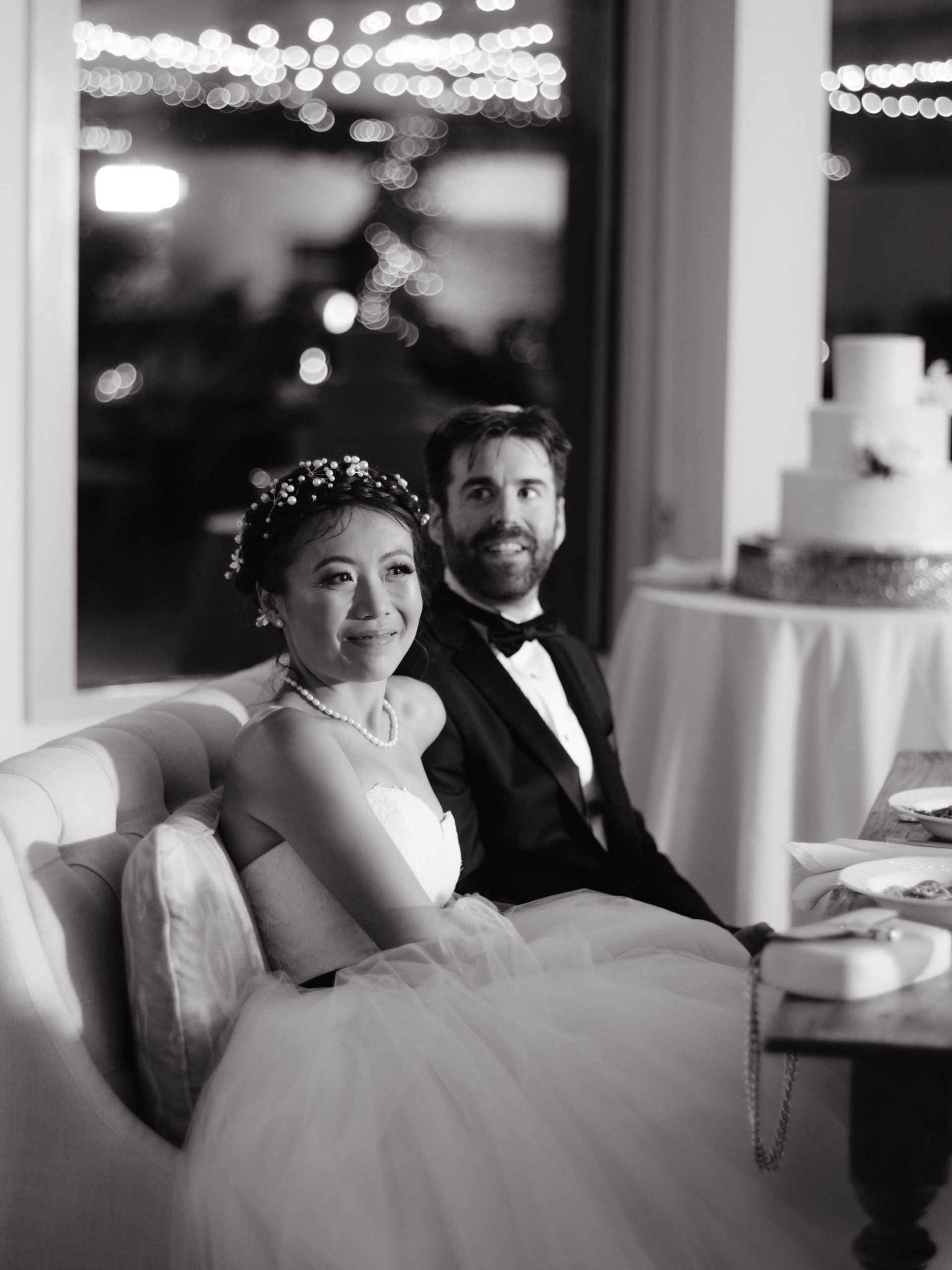 Black and white photo of the newly-weds in the reception. Luxury wedding cake image by Jenny Fu Studio NYC