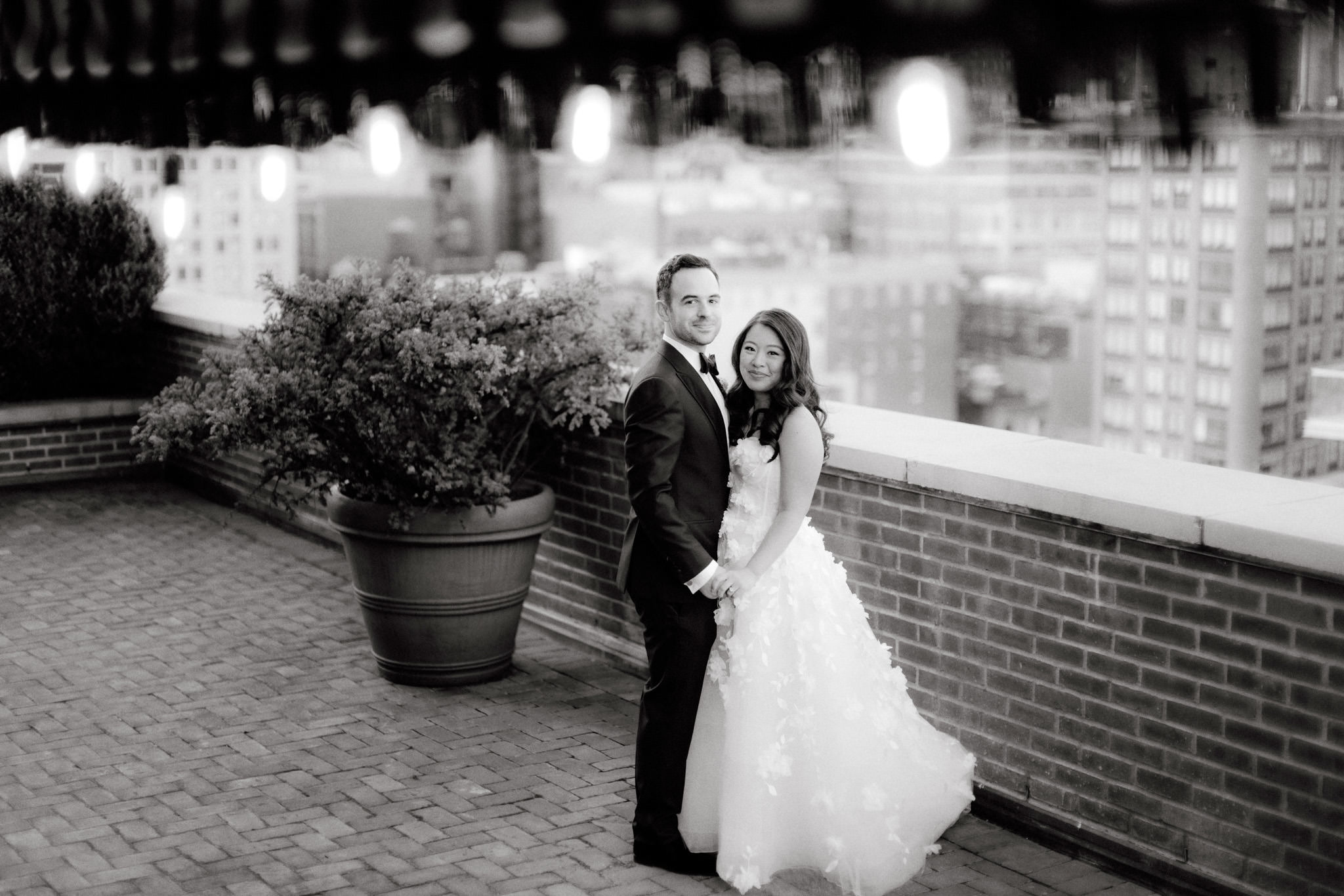 Editorial image of the bride and groom overlooking nyc's skyline. Wedding photography package image by Jenny Fu Studio