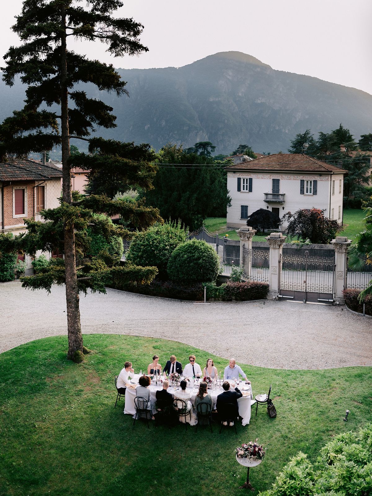 Top view of the small wedding party having their dinner al fresco at Villa Confalonieri. Image by Jenny Fu Studio