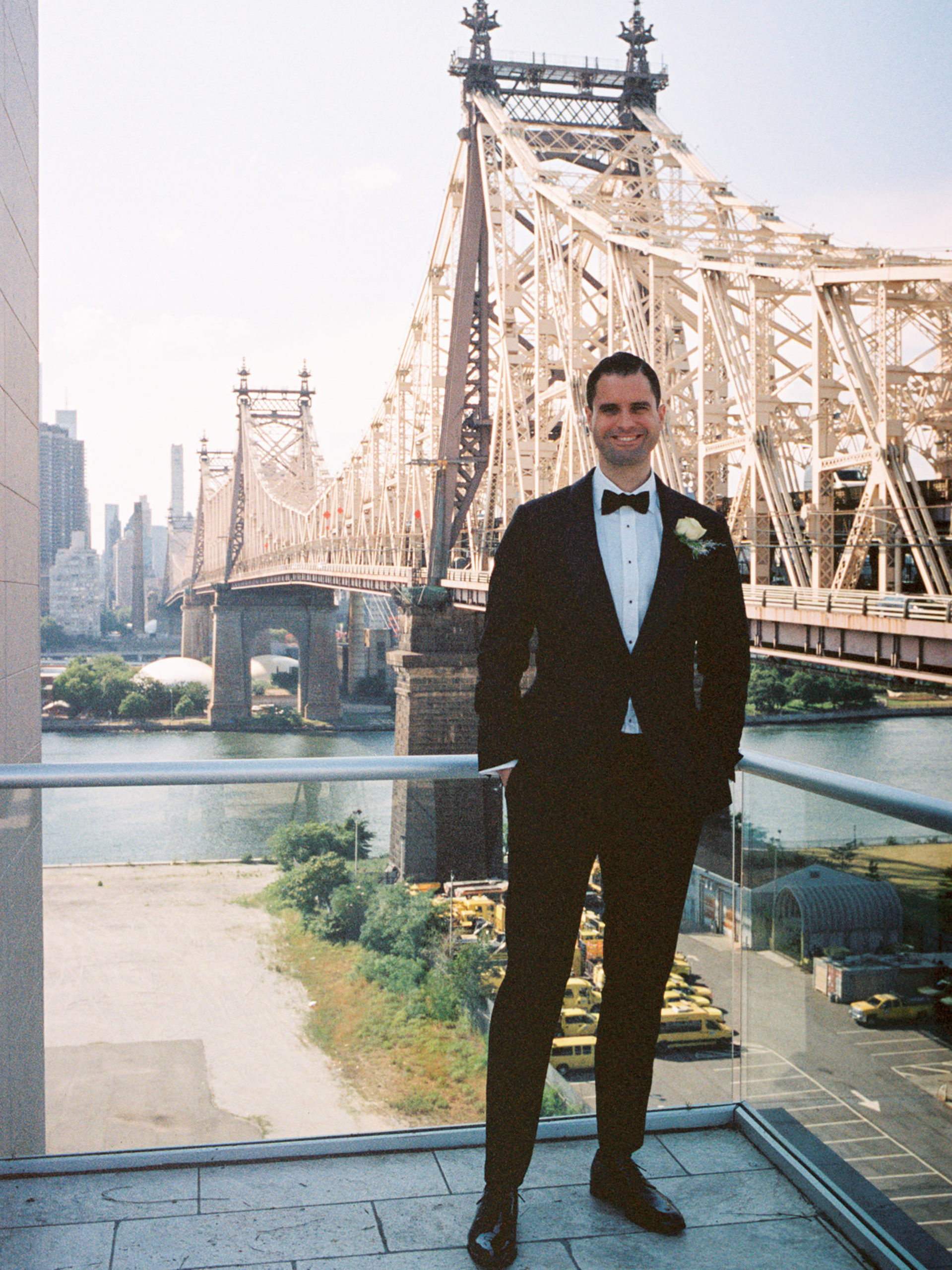 A portrait of the groom with Brooklyn Bridge in the background. Image by Jenny Fu Studio