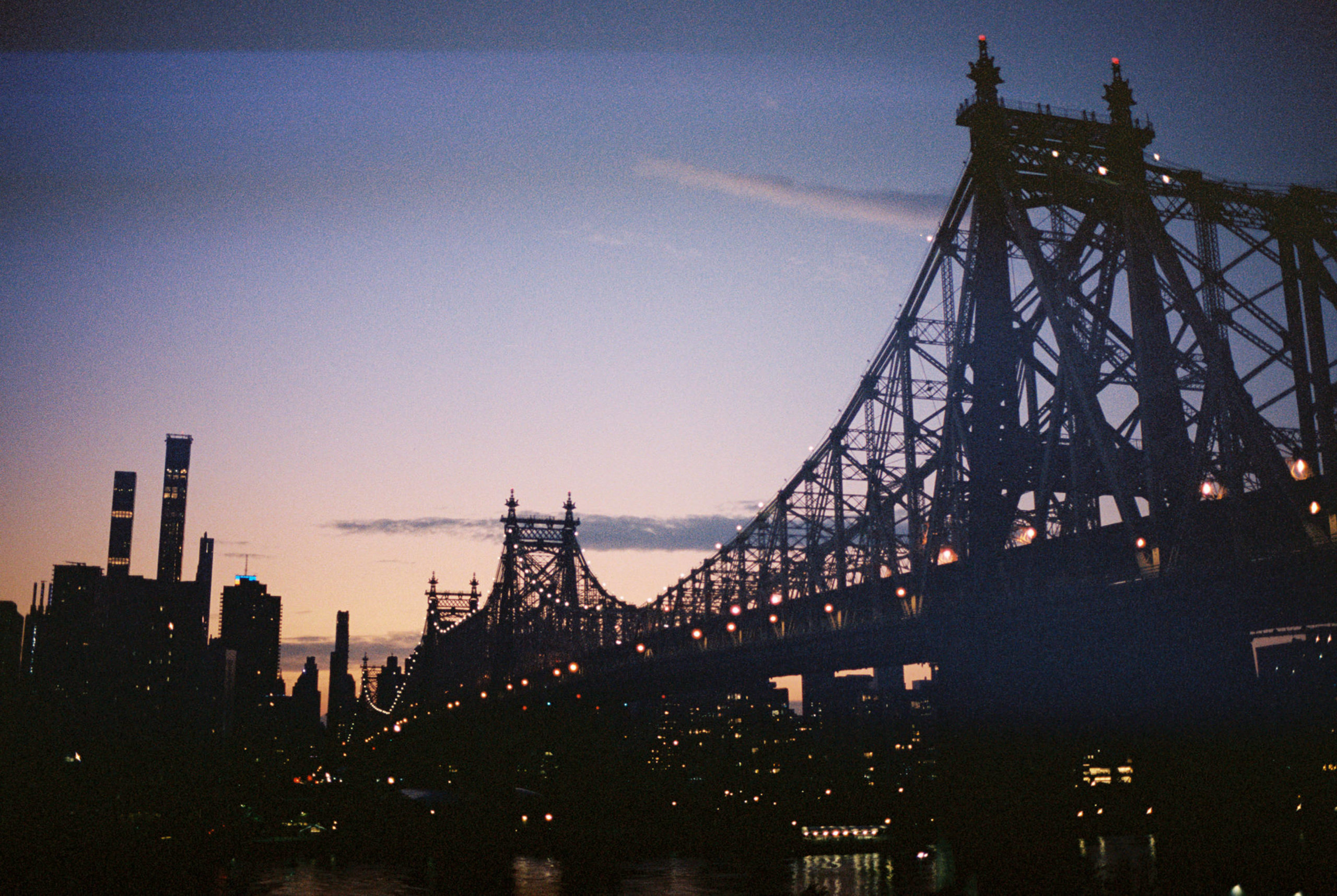 Sunset photo of the Brooklyn Bridge. Film photography image by Jenny Fu Studio