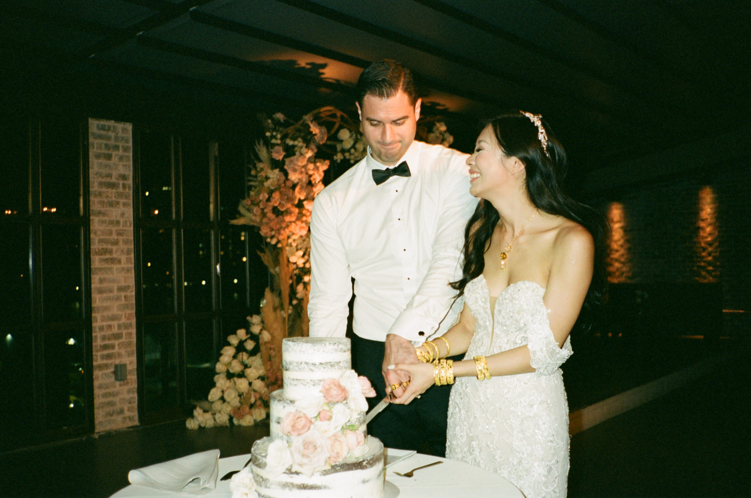 Cake-cutting ceremony. Film wedding photography image by Jenny Fu Studio