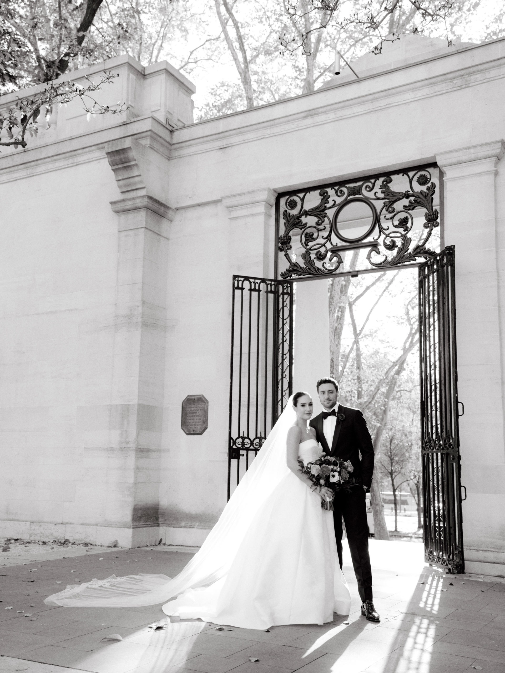 Editorial image of the bride and groom in front of the wedding venue. Luxury wedding venues image by Jenny Fu Studio