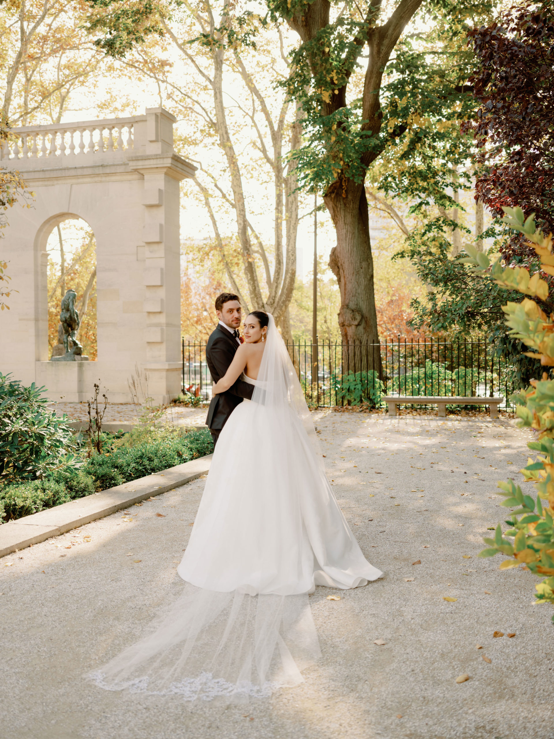 Editorial image of the bride and groom in a beautiful garden. Image by Jenny Fu Studio