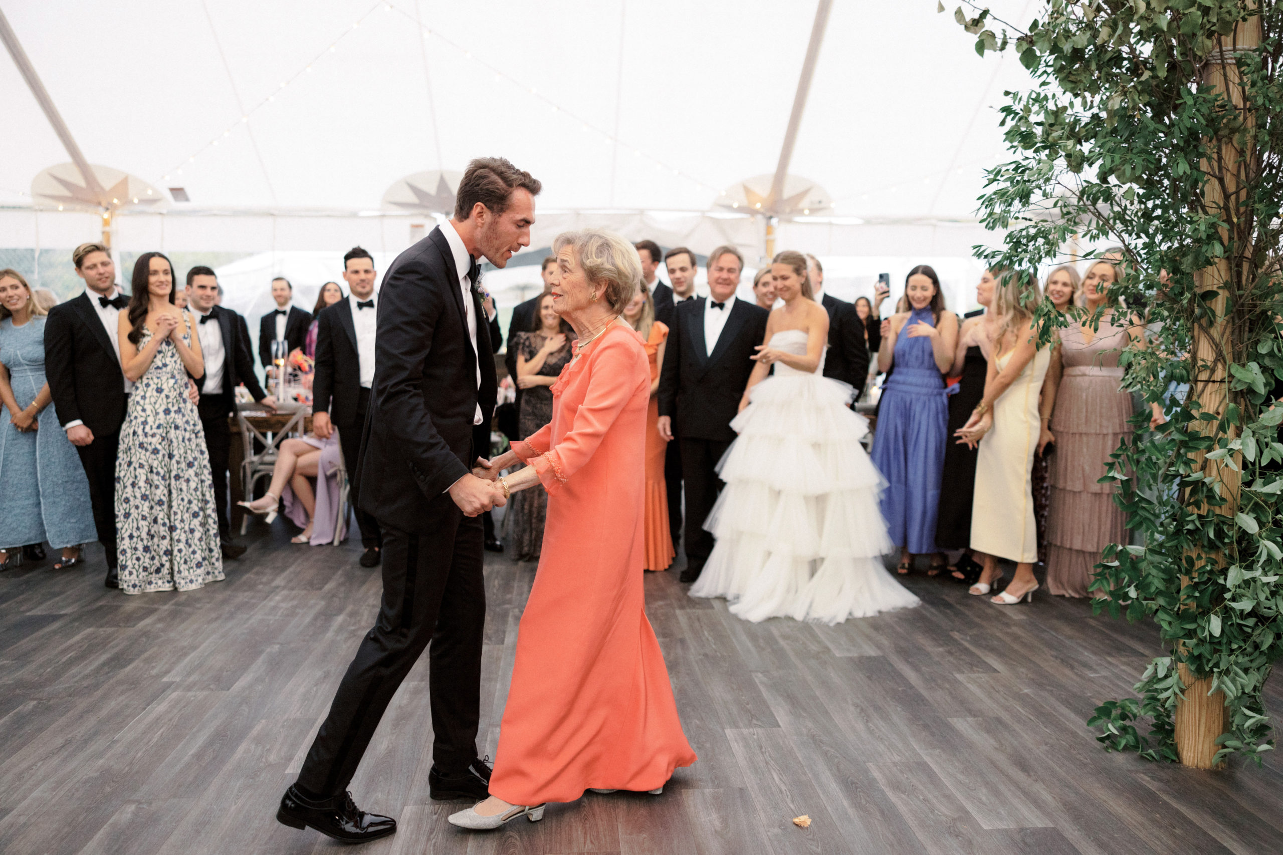 The groom is dancing with his mother. Candid wedding photography image by Jenny Fu Studio