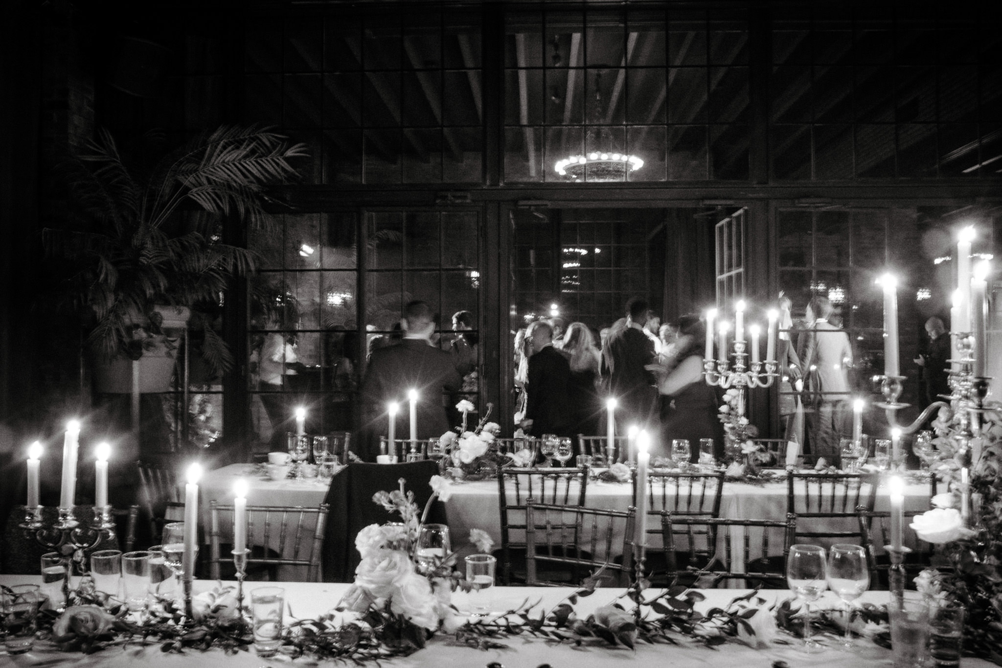 Black and white editorial photo of a wedding reception party. Wedding photography add-ons image by Jenny Fu Studio