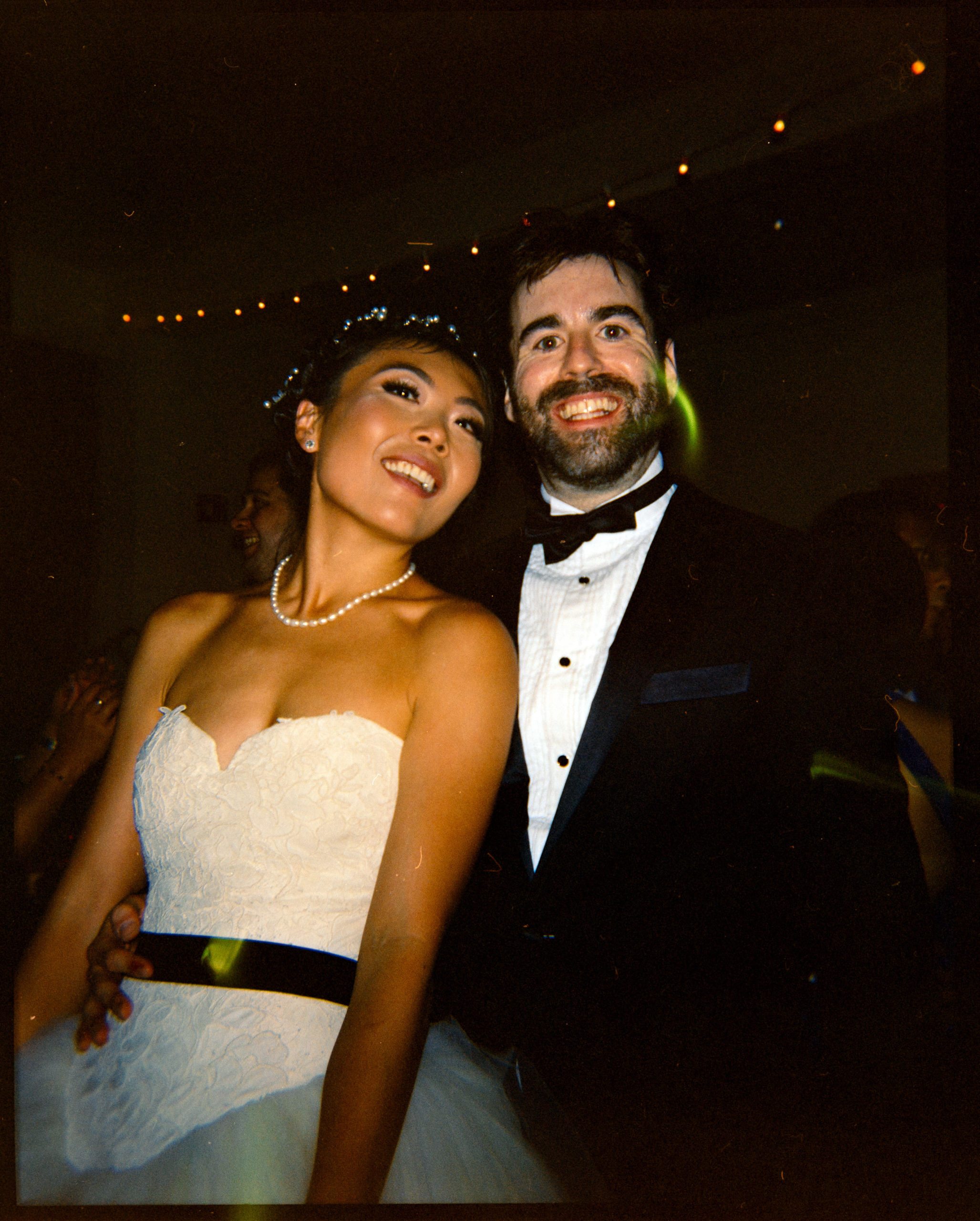 The bride and groom are on the dance floor. Image by Jenny Fu Studio