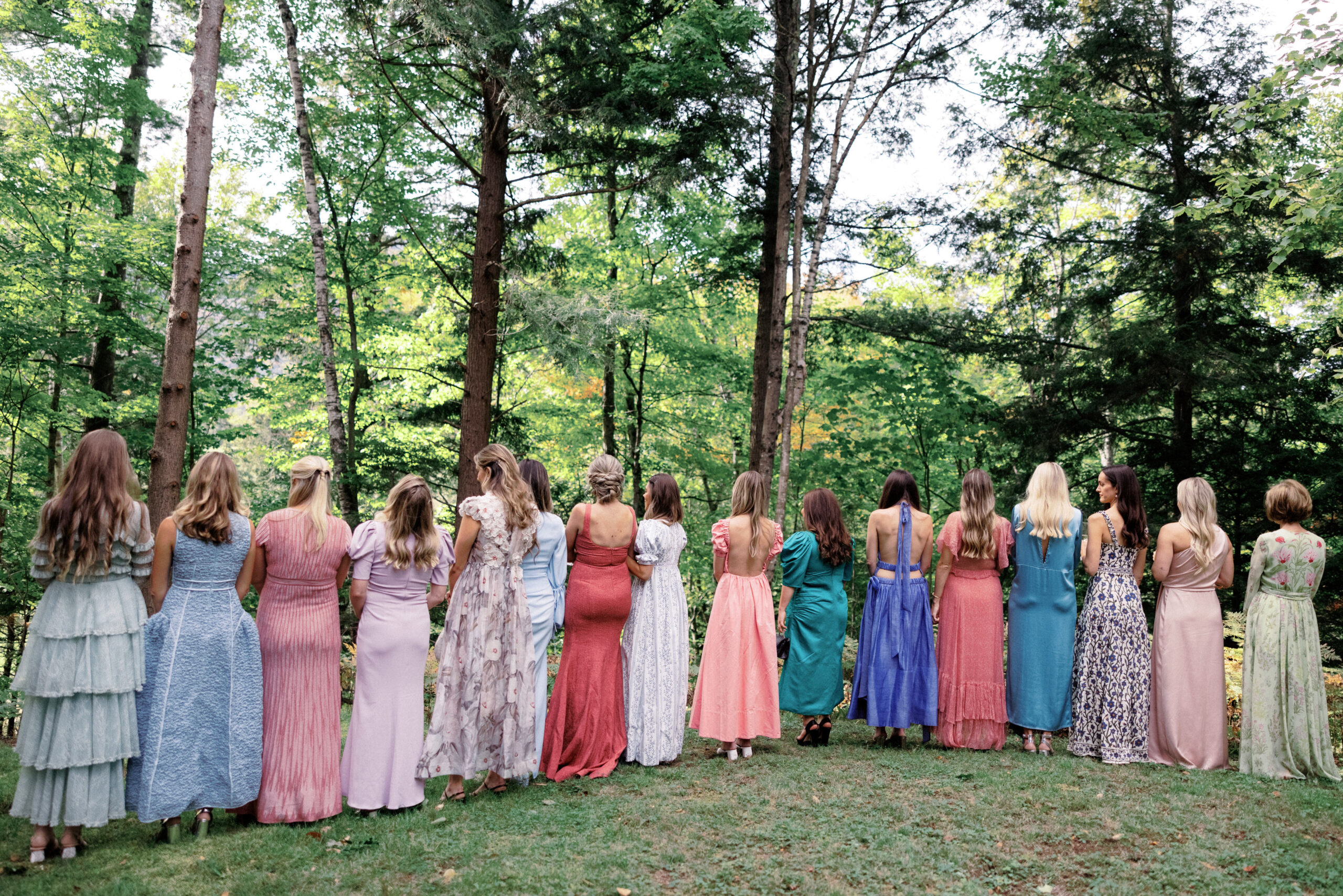 The bridesmaids are in one line, with backs turned from the bride. Upstate New York luxury wedding image by Jenny Fu Studio.