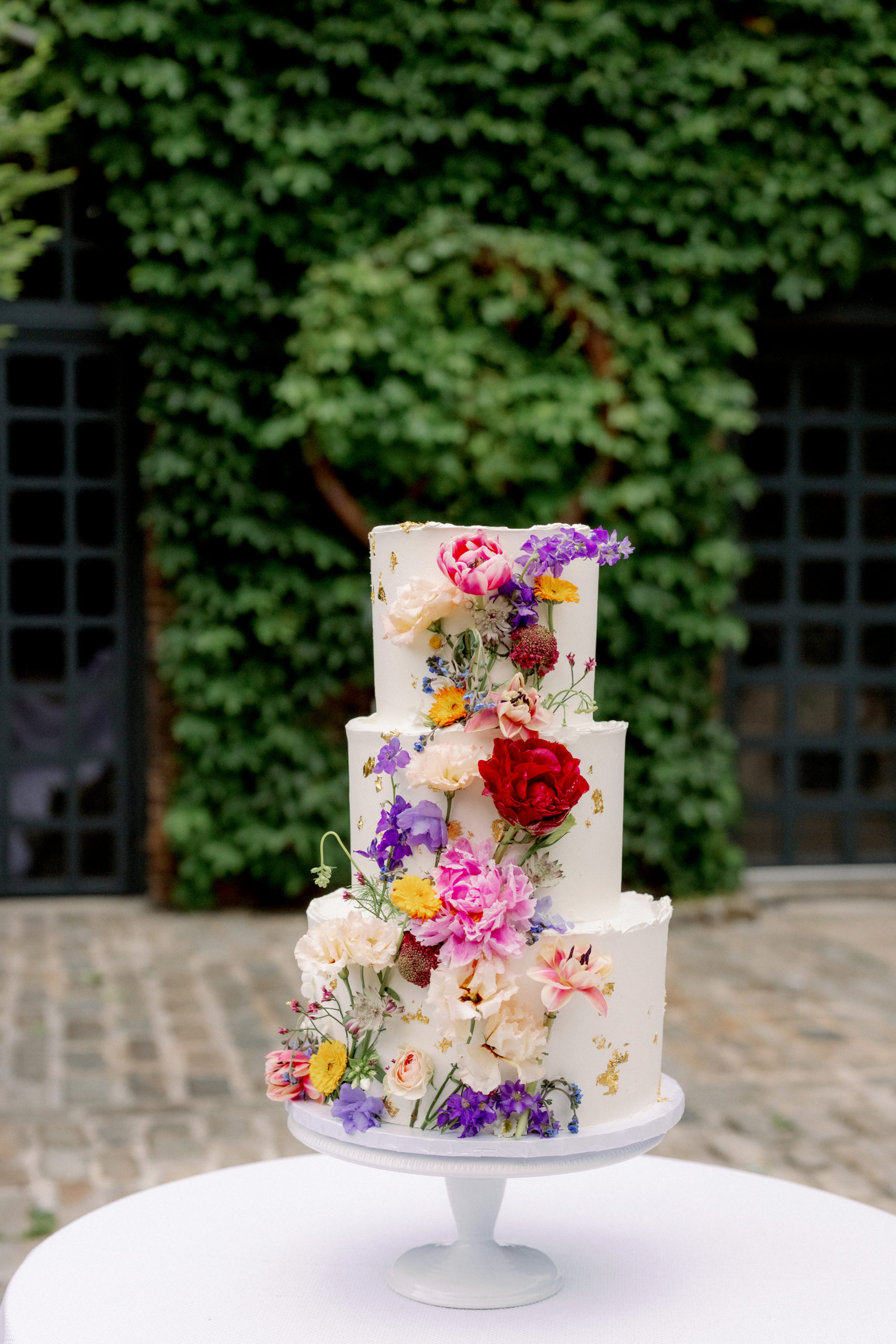 A beautiful wedding cake. Film vs. digital wedding photography image by Jenny Fu Studio