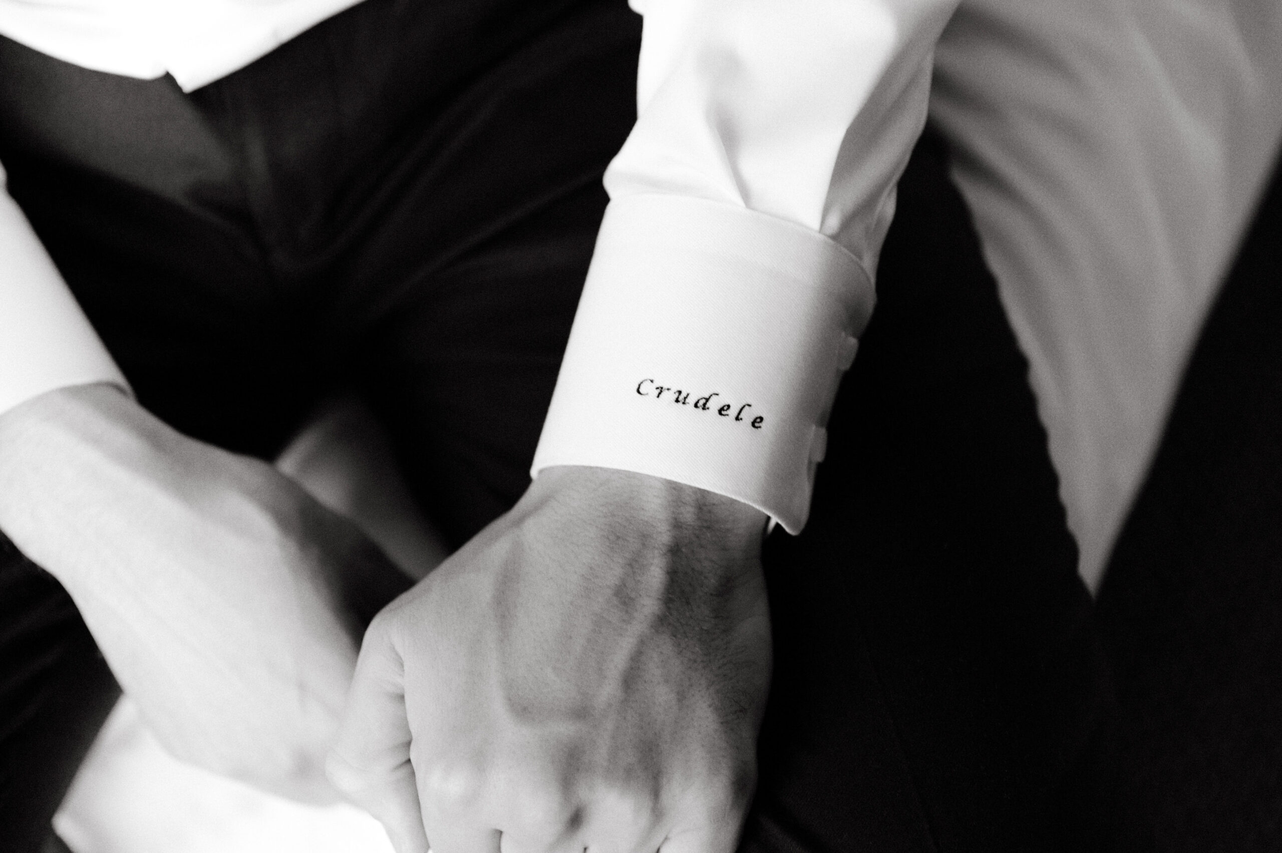 Black and white Editorial image of the groom's cuff. Image by Jenny Fu Studio