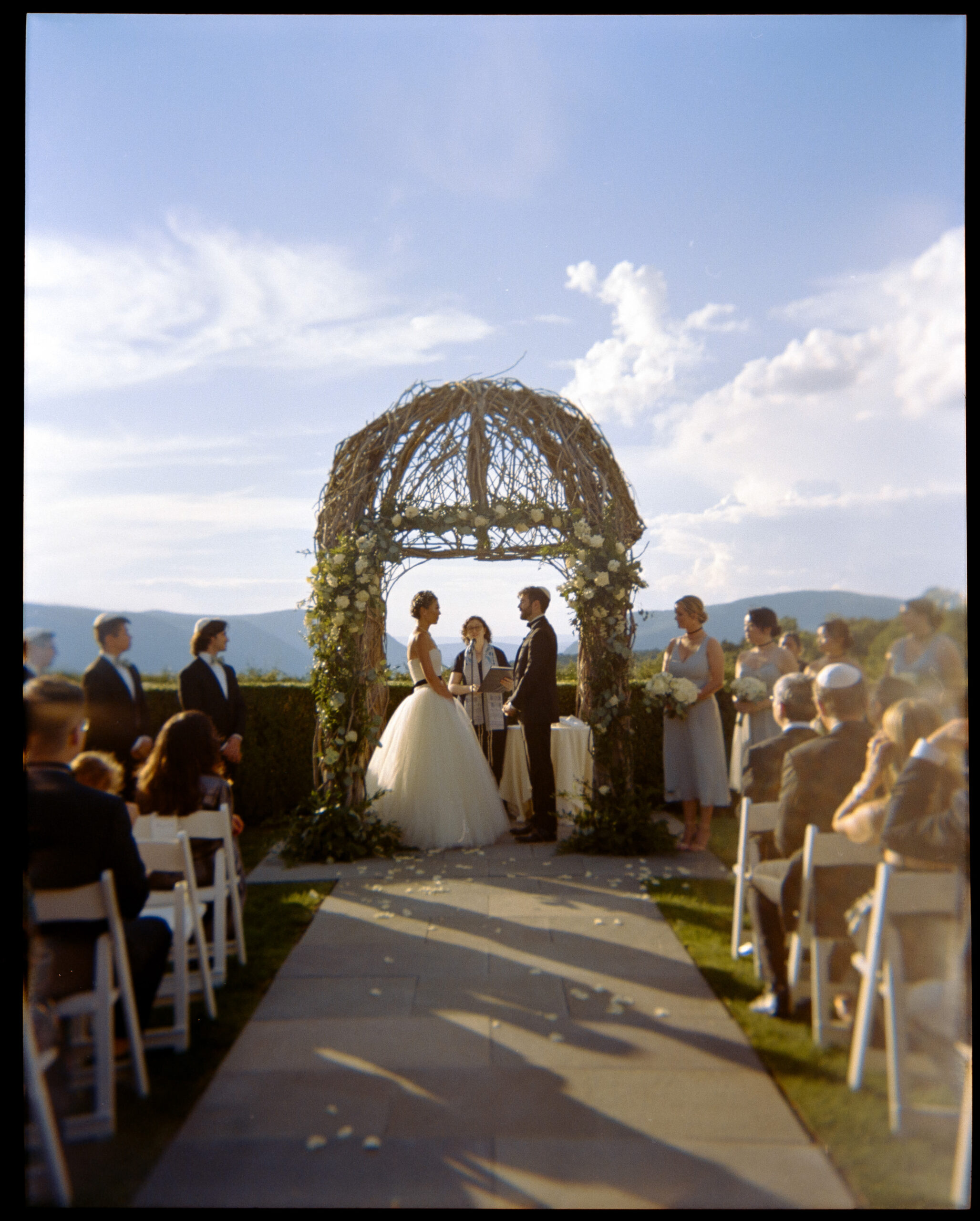Wedding ceremony image outdoors. Film photography image by Jenny Fu Studio