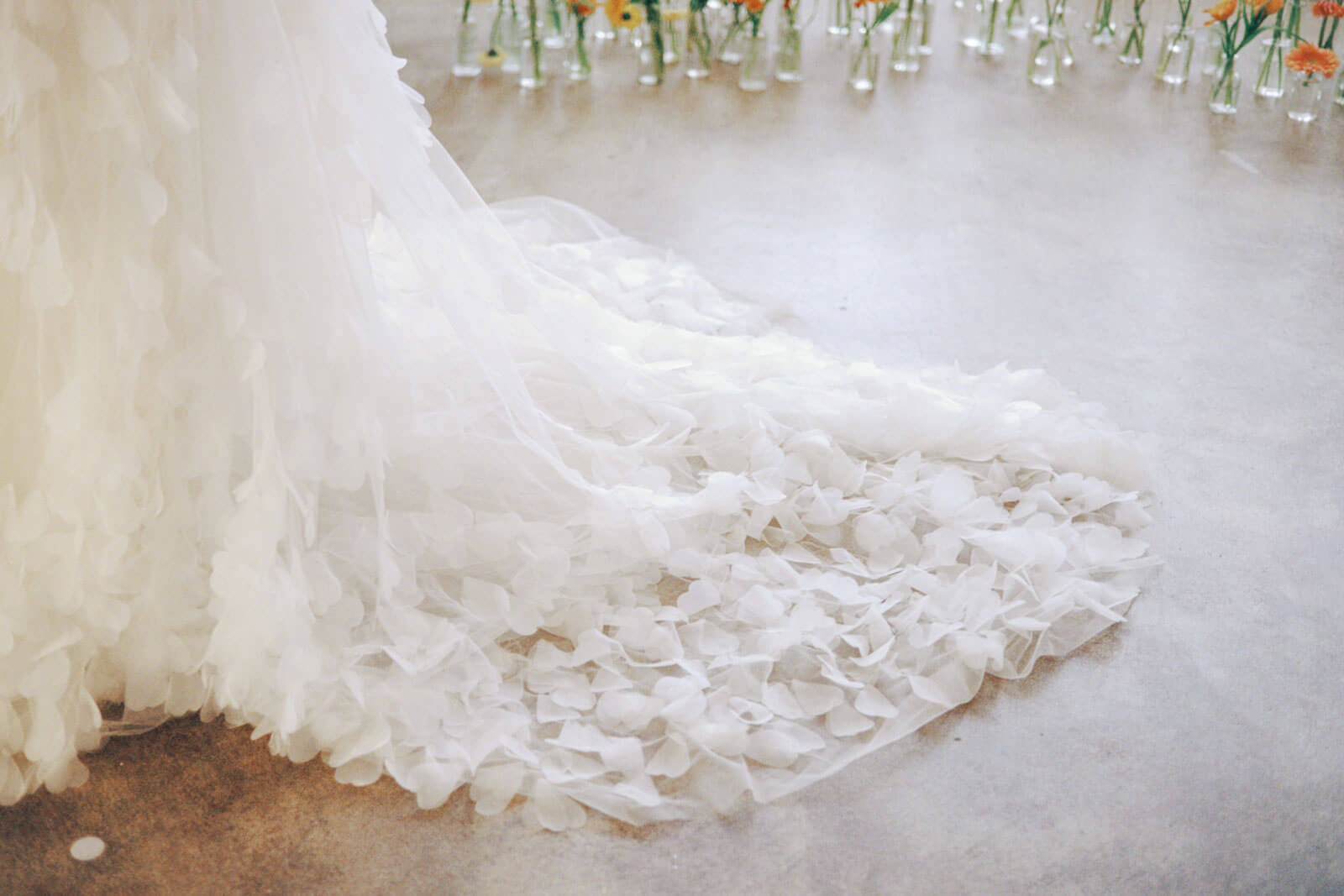 Train of a wedding gown with 3d flowers. Image by Jenny Fu Studio