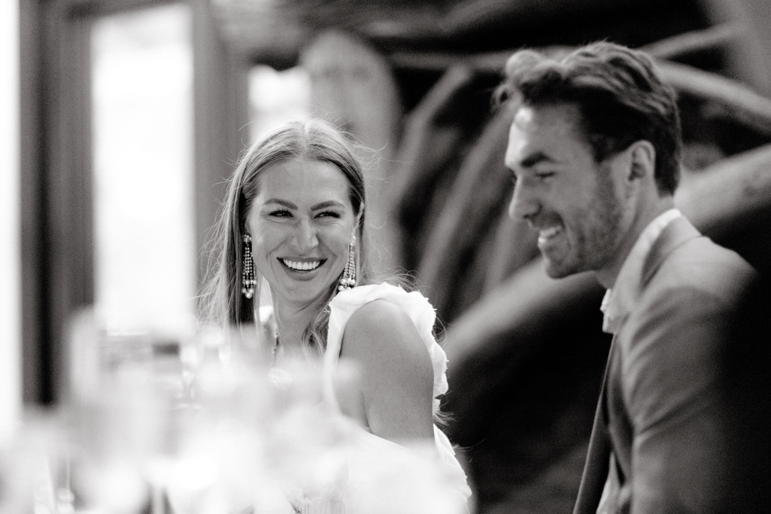 Editorial image of the bride smiling at the groom. Image by Jenny Fu Studio