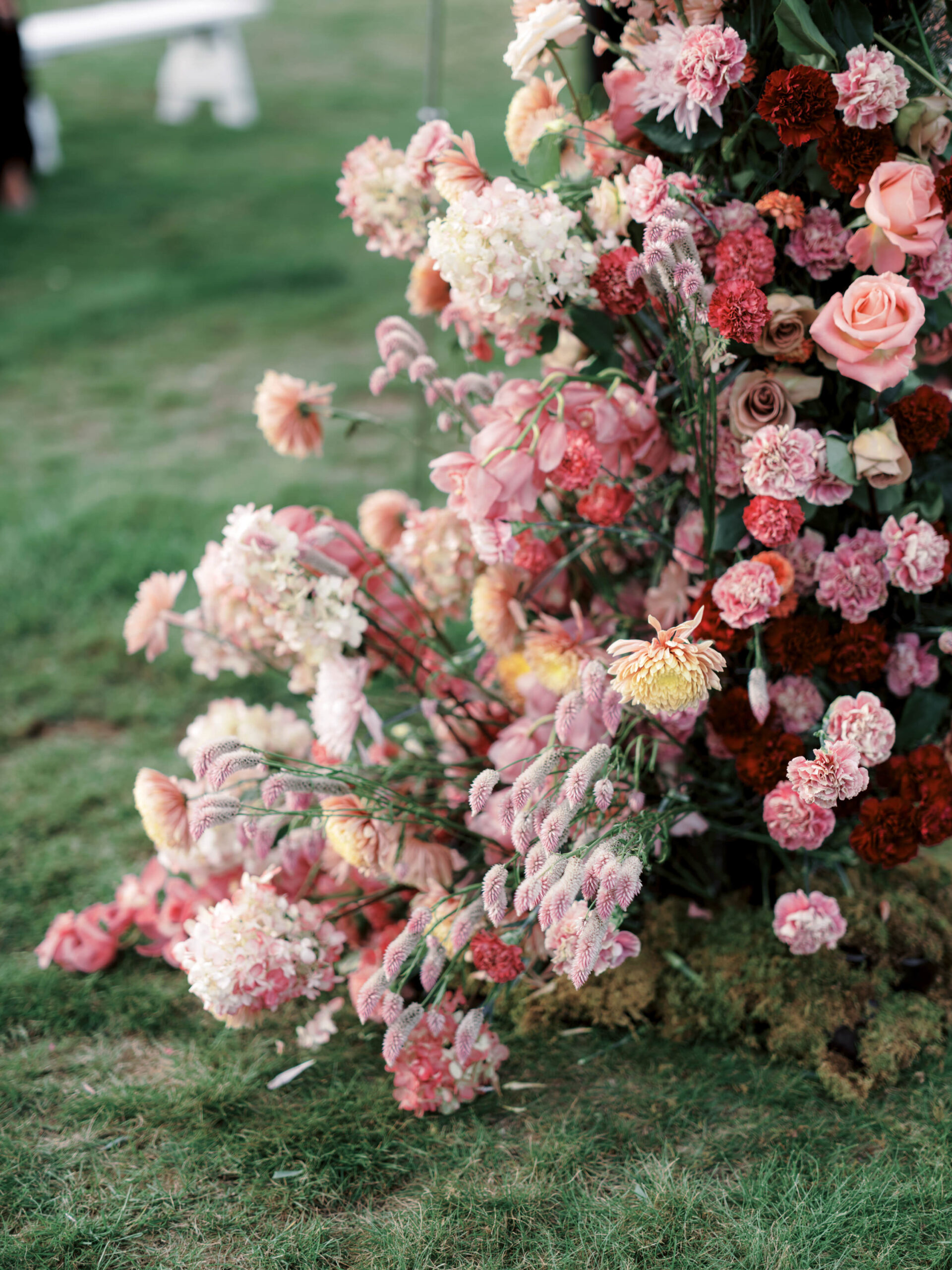 Beautiful flowers in shades of pink, peach and red. Image by Jenny Fu Studio