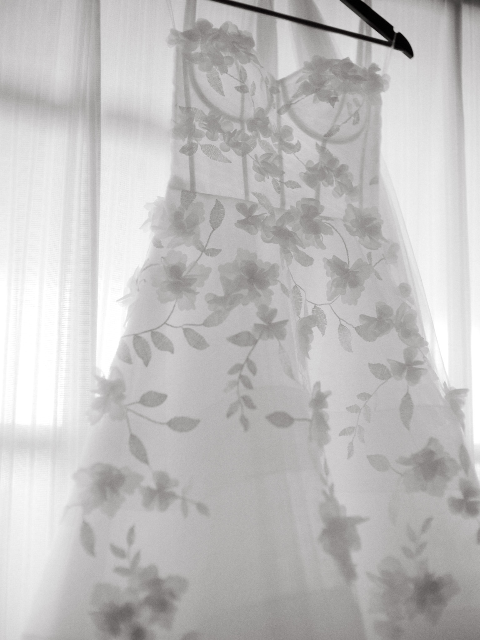Close-up photo of the bride's wedding dress. Image by Jenny Fu Studio