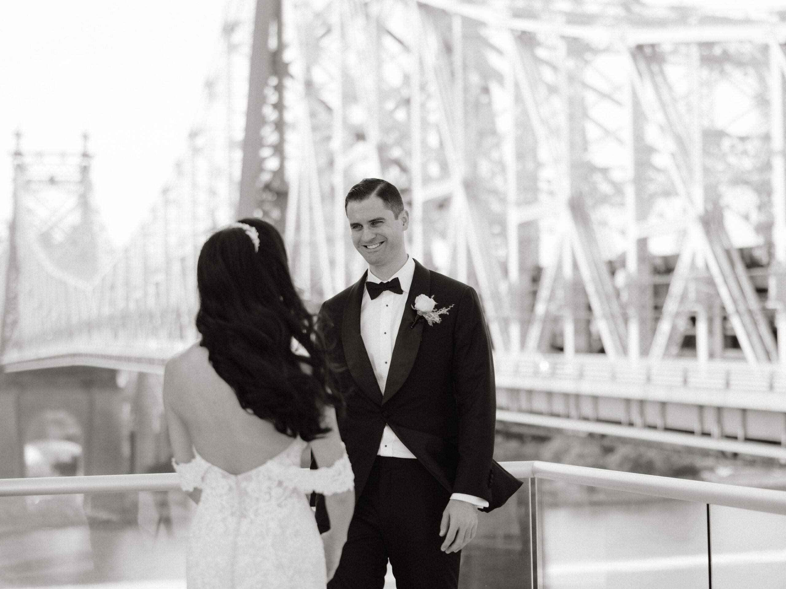 Black and white first look editorial image at the Brooklyn Bridge by Jenny Fu Studio