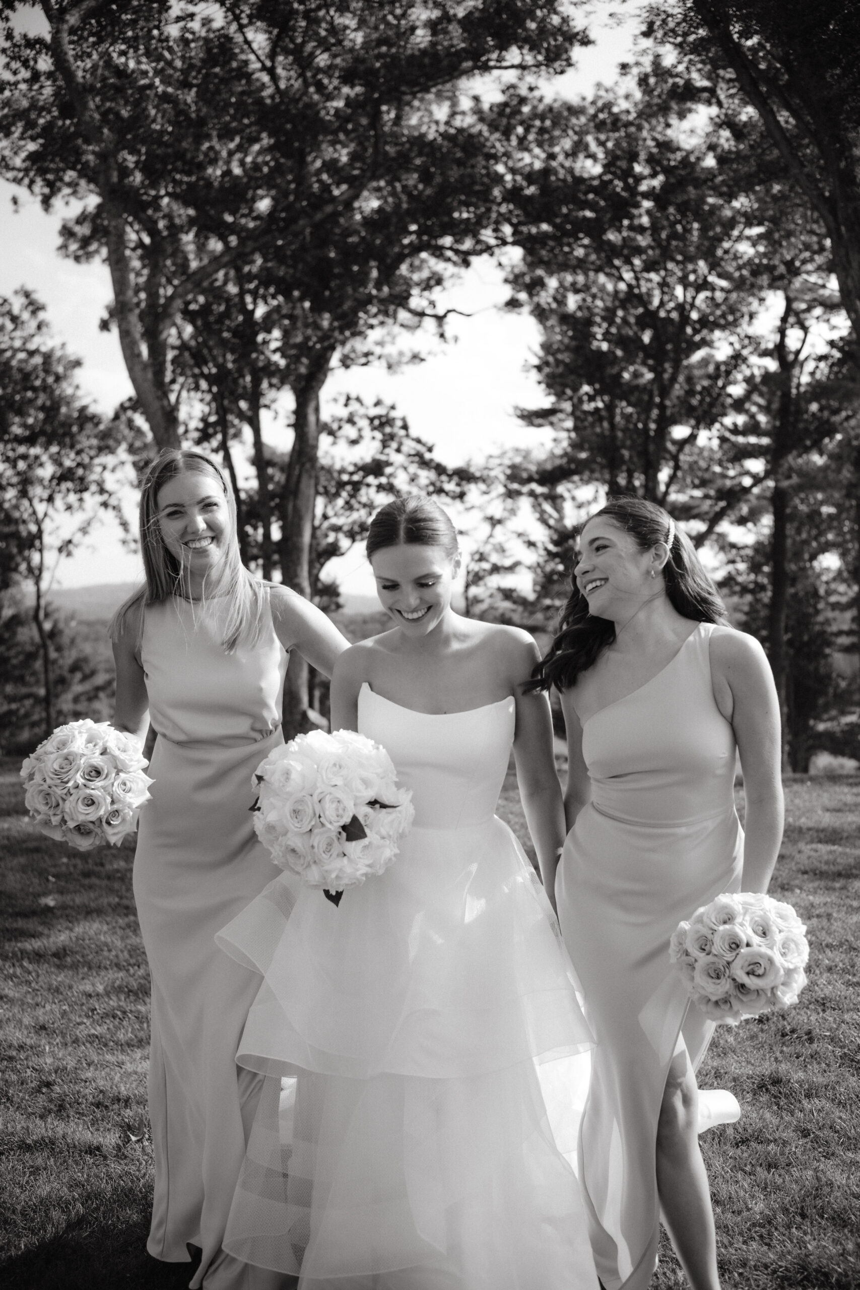 Black and white image of the bride with her bridesmaids. Image by Jenny Fu Studio