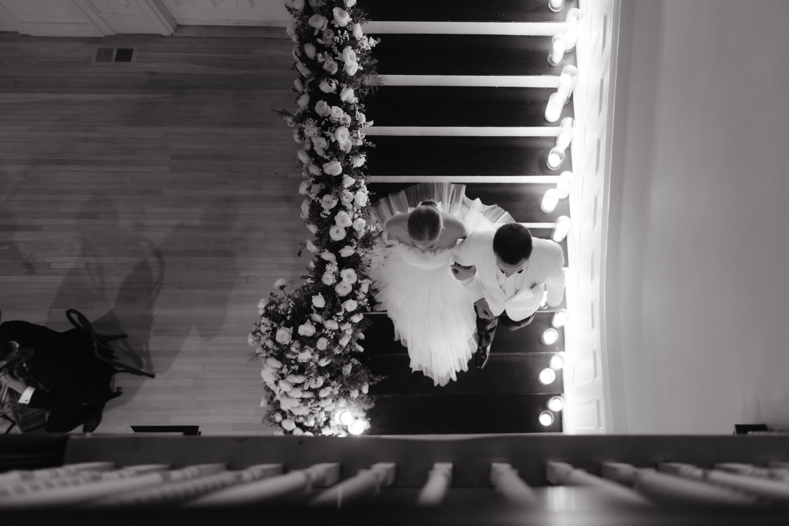 Black and white top view photo of the bride and groom walking down the stairs. Wedding photography wish list photo by Jenny Fu Studio