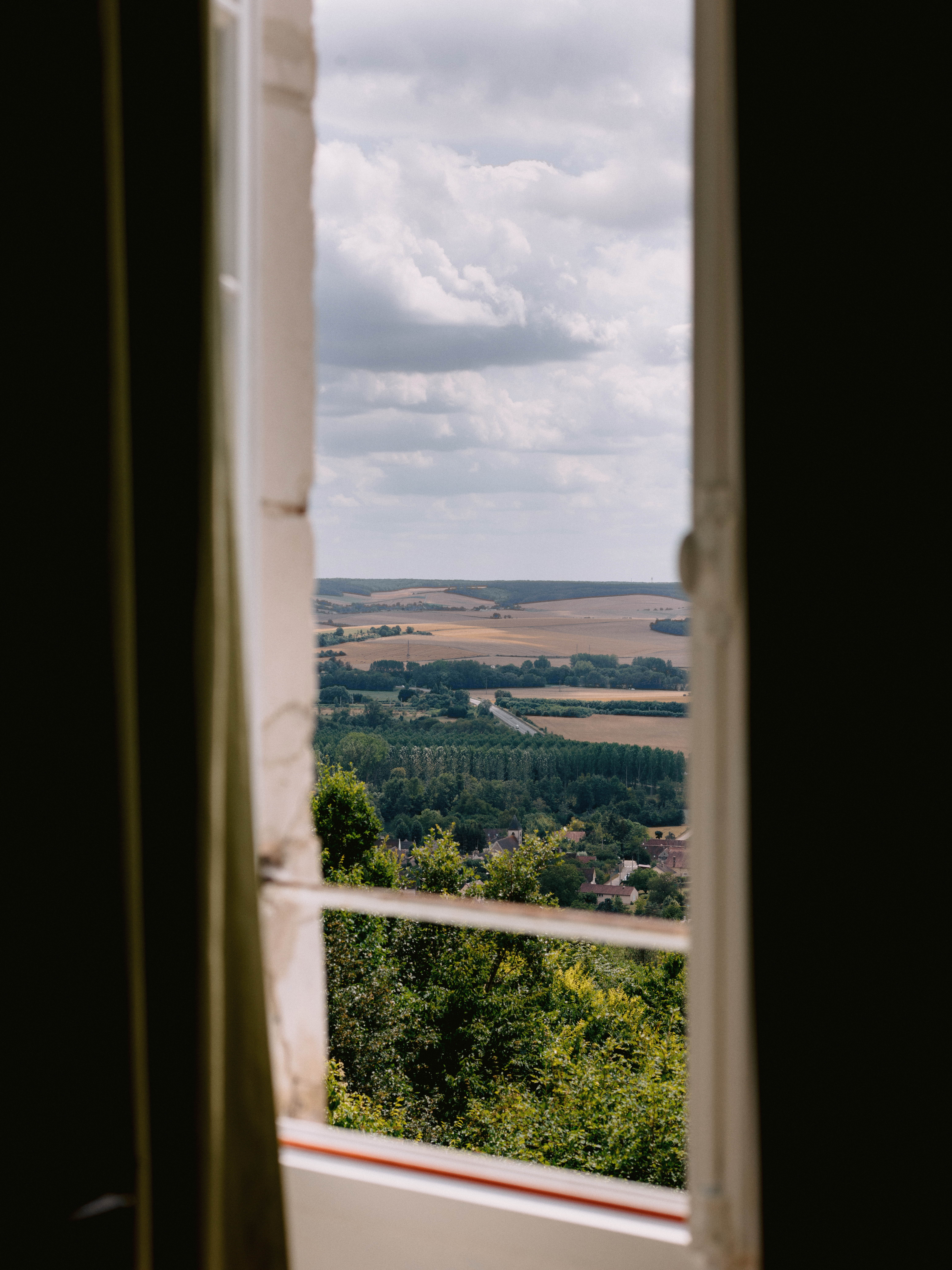 A view of rolling hills from the window of Chateau Du Fey. Photo by Jenny Fu Studio
