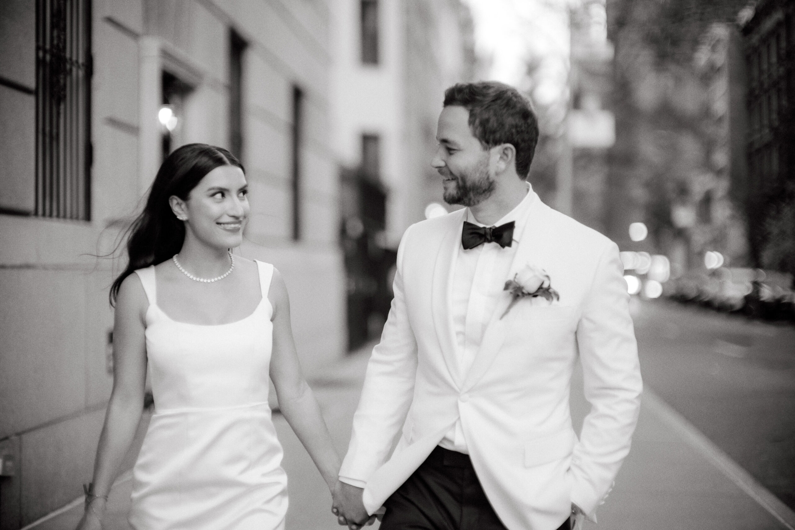 The newly-weds are happily walking the streets of New York City. Image by Jenny Fu Studio