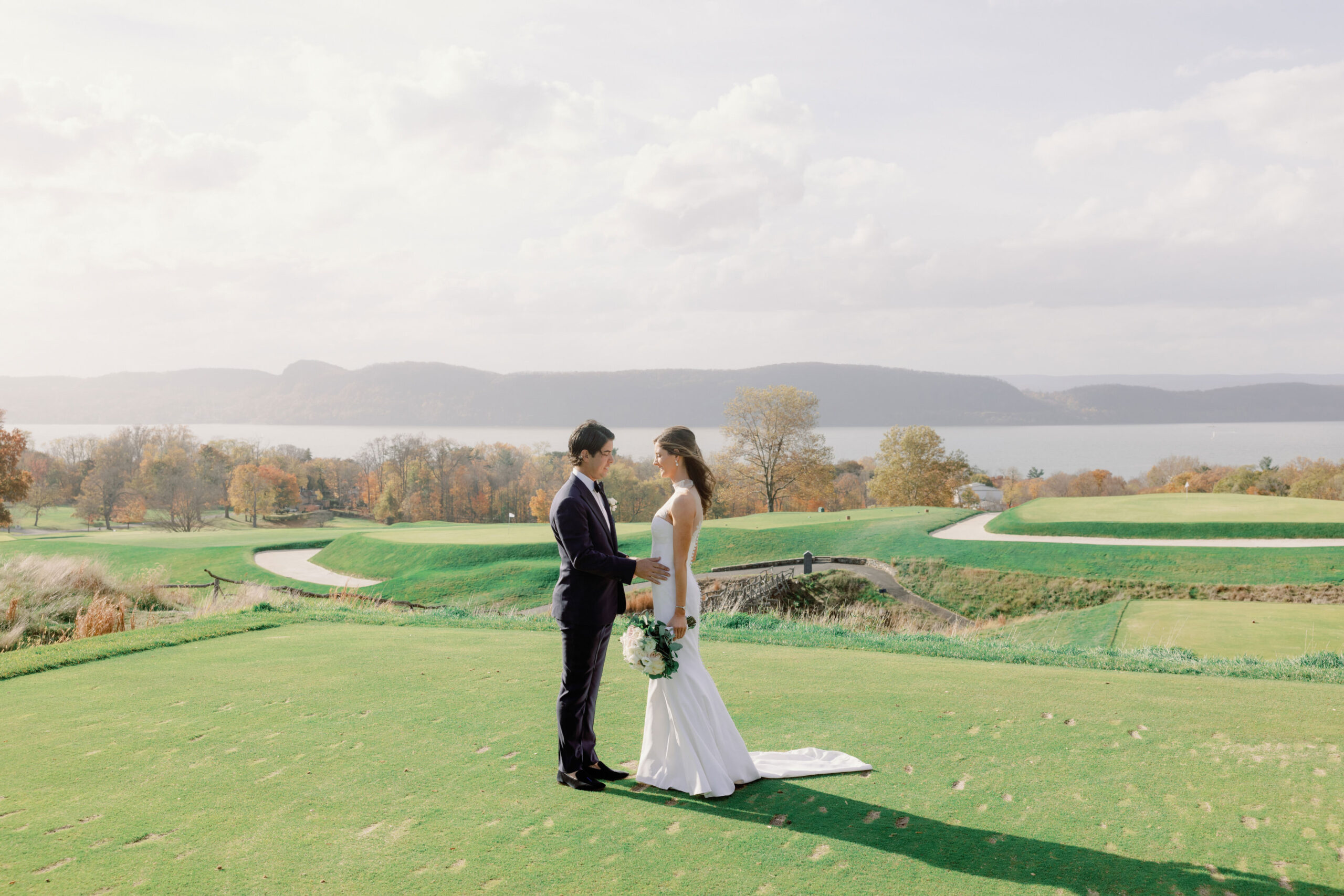 Editorial photo of the bride and groom with gold course in the background at Sleepy Hollow Countryclub, NY.  Image by Jenny Fu Studio 