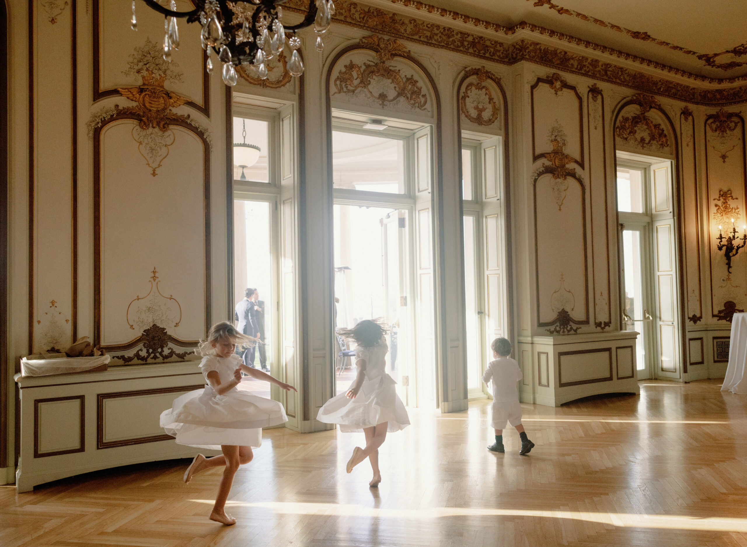 Flower girls are dancing in a huge room. Latest wedding trends image by Jenny Fu Studio