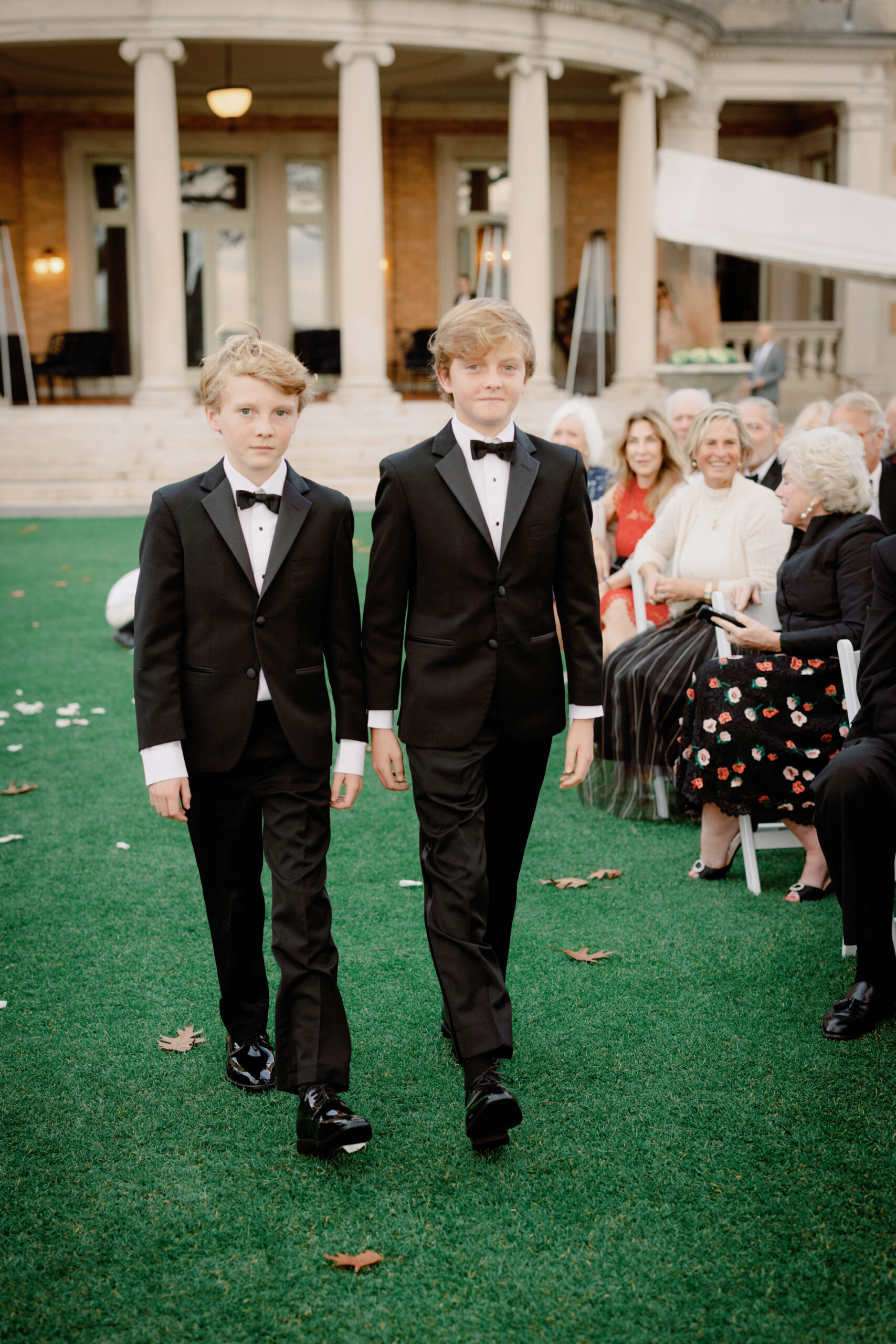Image of the young men walking down the aisle at Sleepy Hollow Country Club, NY. Image by Jenny Fu Studio