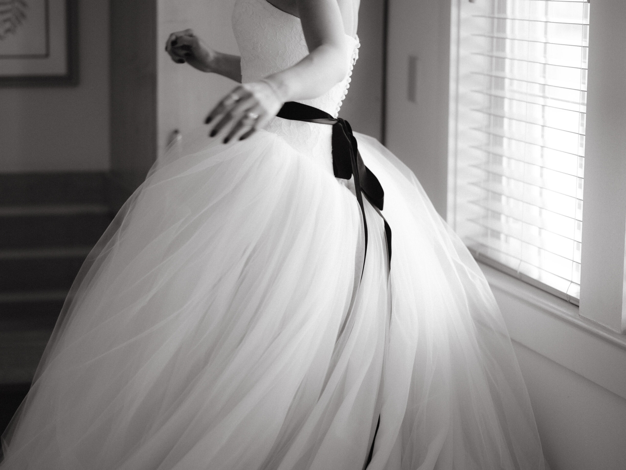 Black and white image of the wedding dress worn by the bride. Wedding Personal style image by Jenny Fu Studio