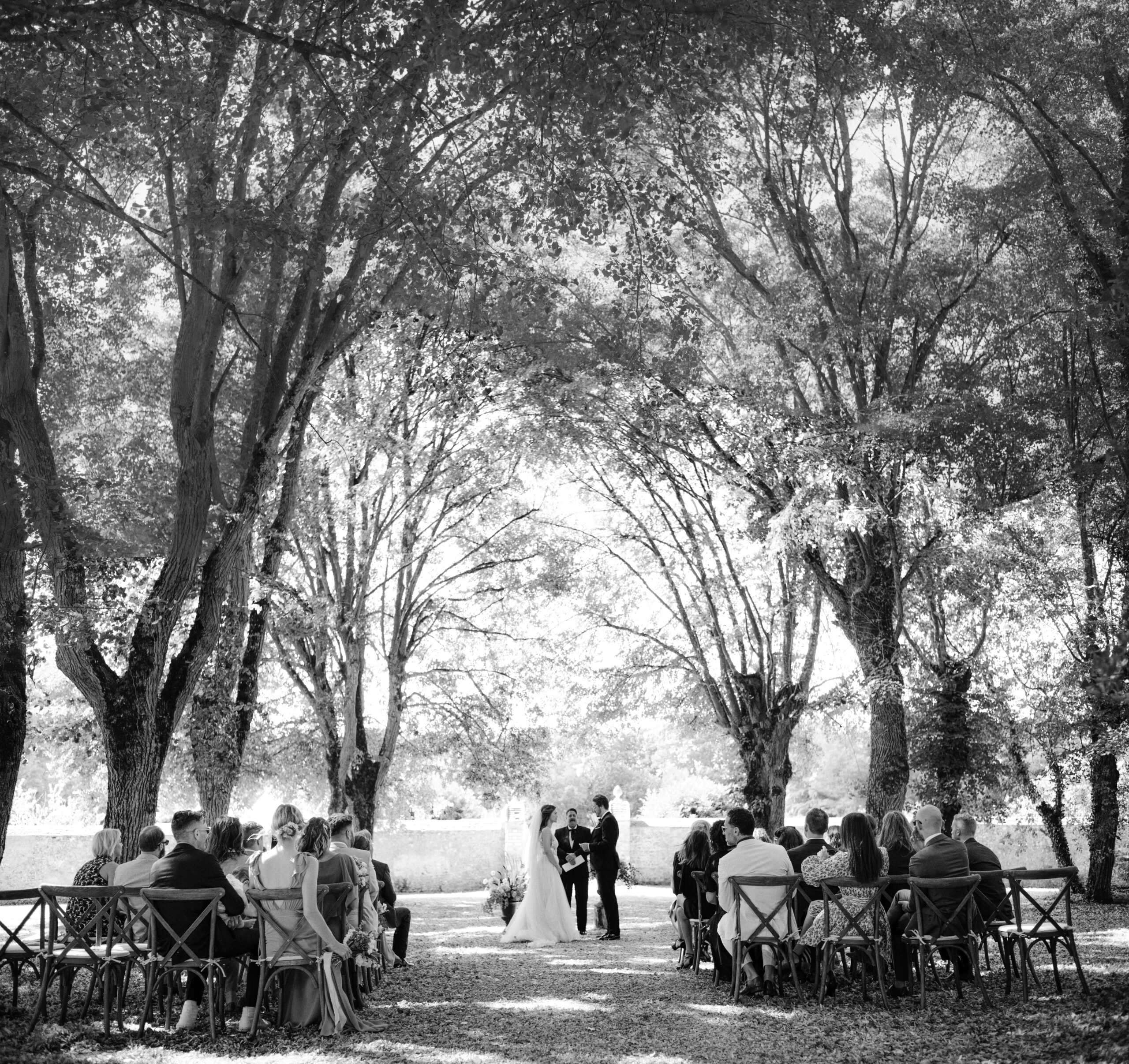 Black and white image of a wedding ceremony outdoor. Wedding in  France photo by Jenny Fu Studio