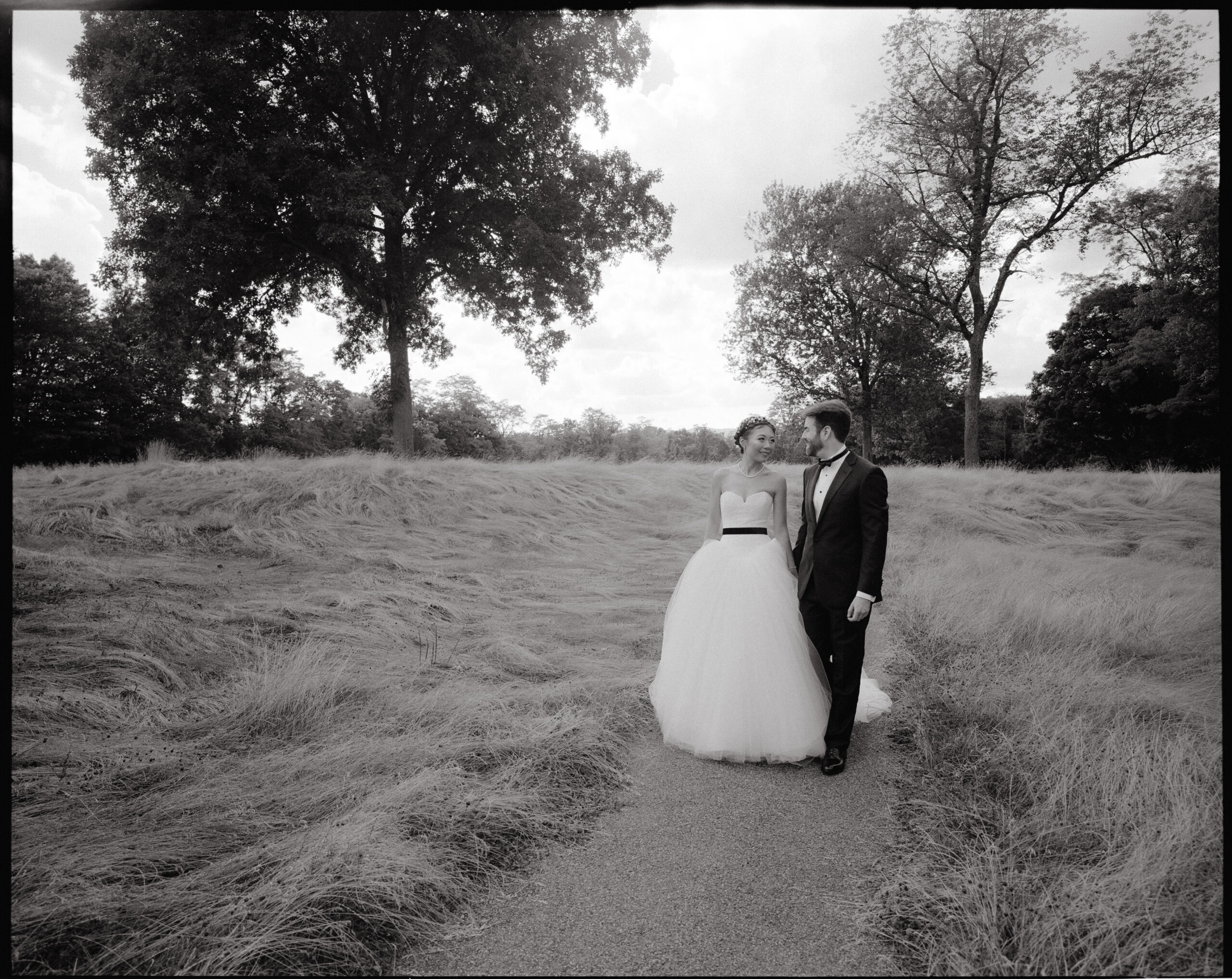 Black and white, first look photo of the couple. Golden hour photo by Jenny Fu Studio