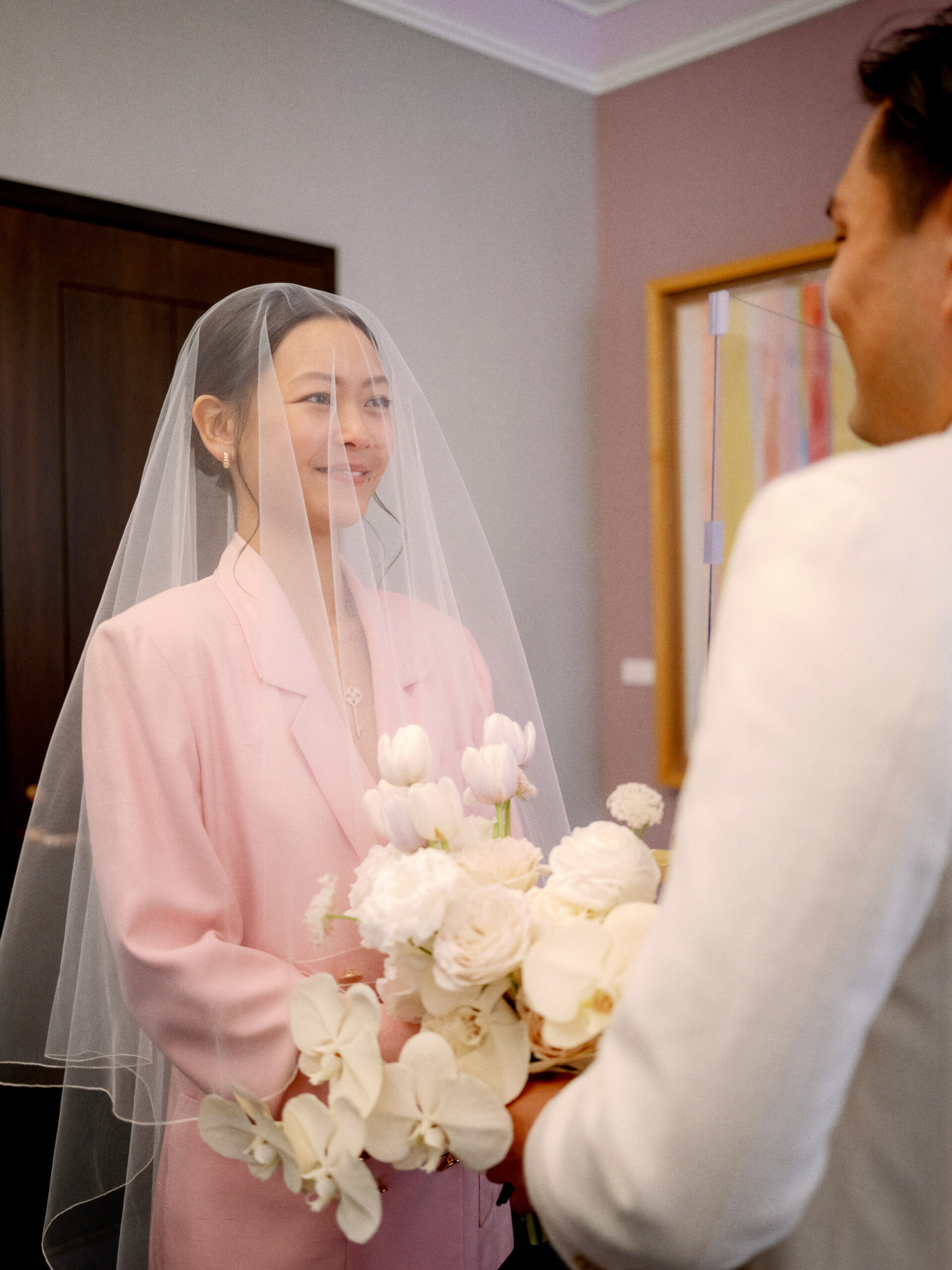 The bride is smiling while looking at the groom during the wedding ceremony at NYC. Documentary Wedding Photography Image by Jenny Fu Studio