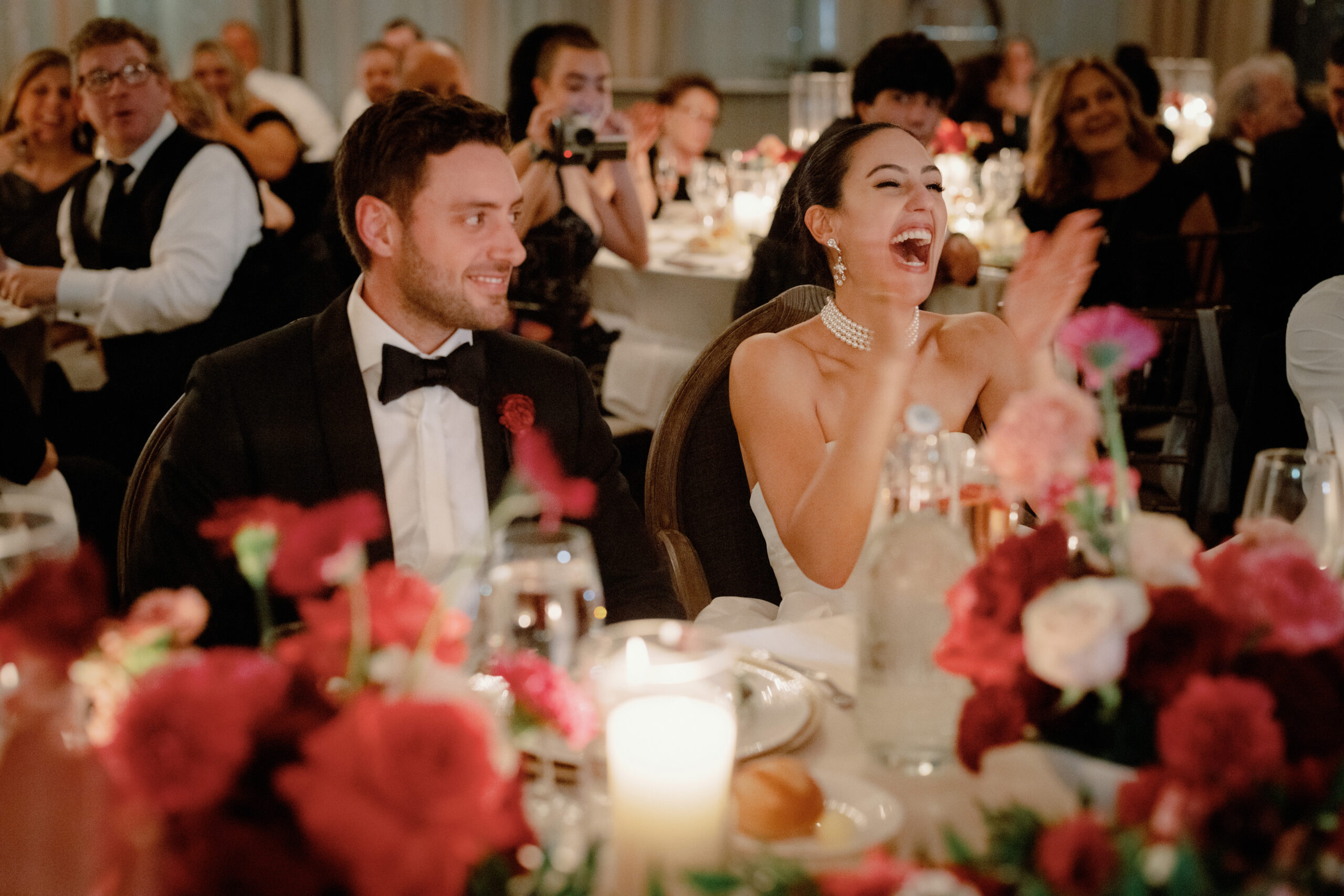 Candid photo of the newlyweds in the wedding reception. Image by Jenny Fu Studio