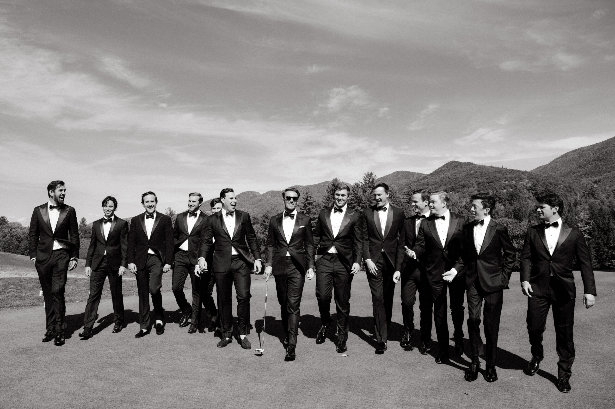 Black and white editorial image of the groom and groomsmen. Heirloom wedding album image by Jenny Fu Studio