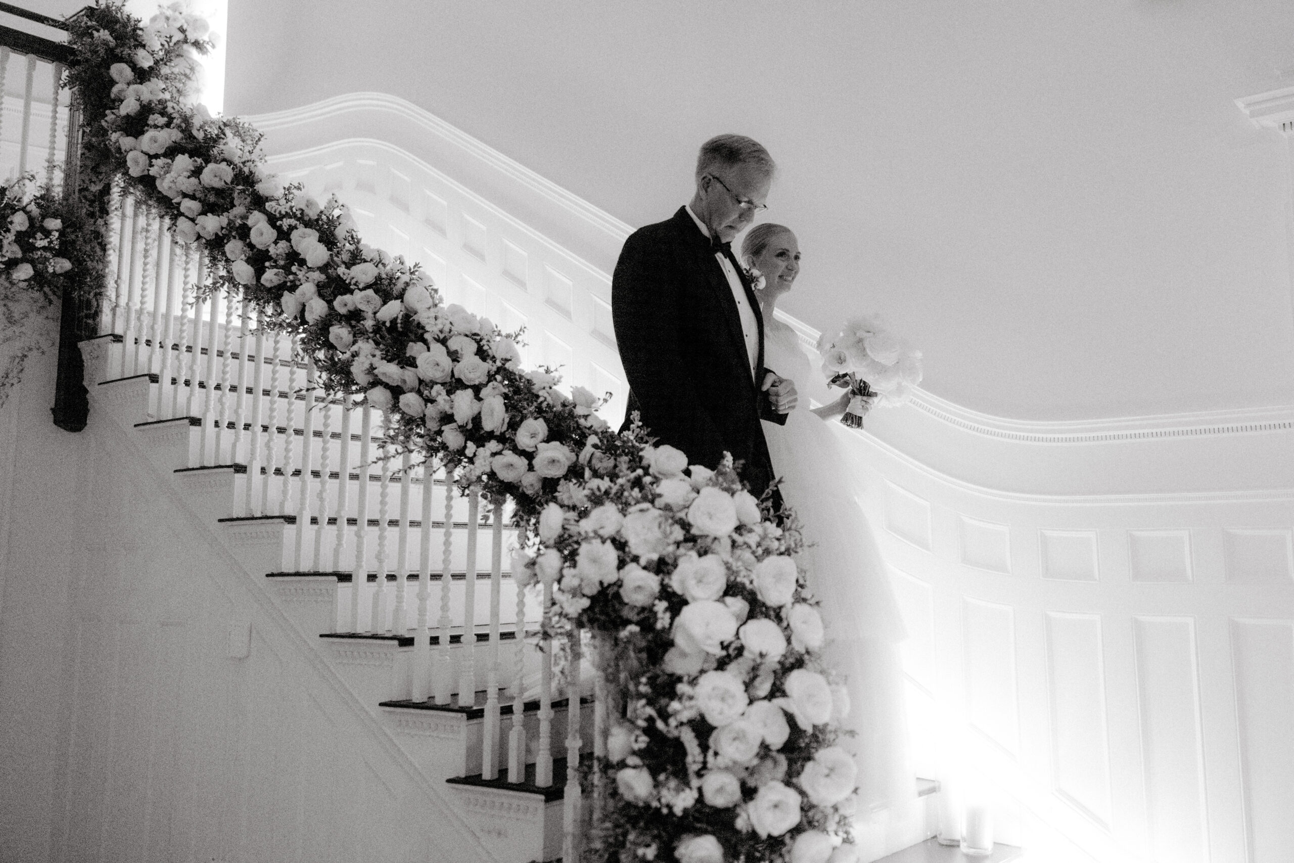 The bride and her father are walking down the staircase. Wedding Trends image by Jenny Fu Studio