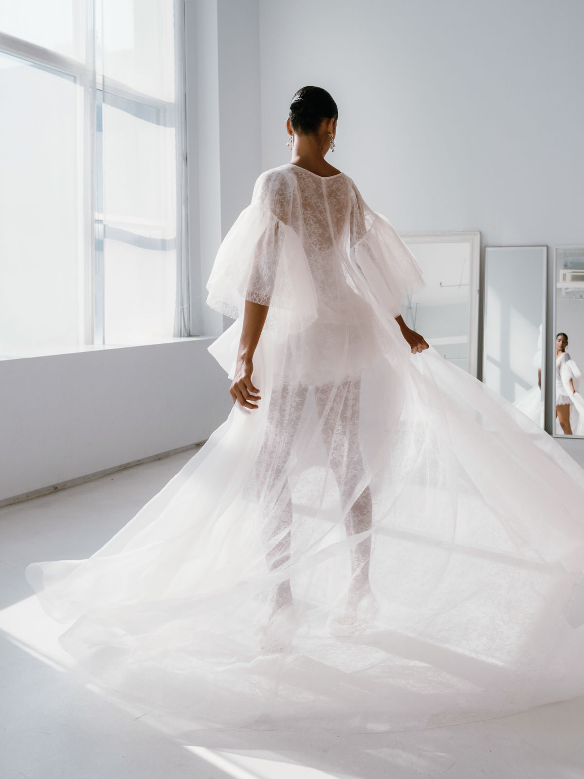 Back view of a model wearing a wedding dress at the  New York Bridal Fashion Week. Image by Jenny Fu Studio