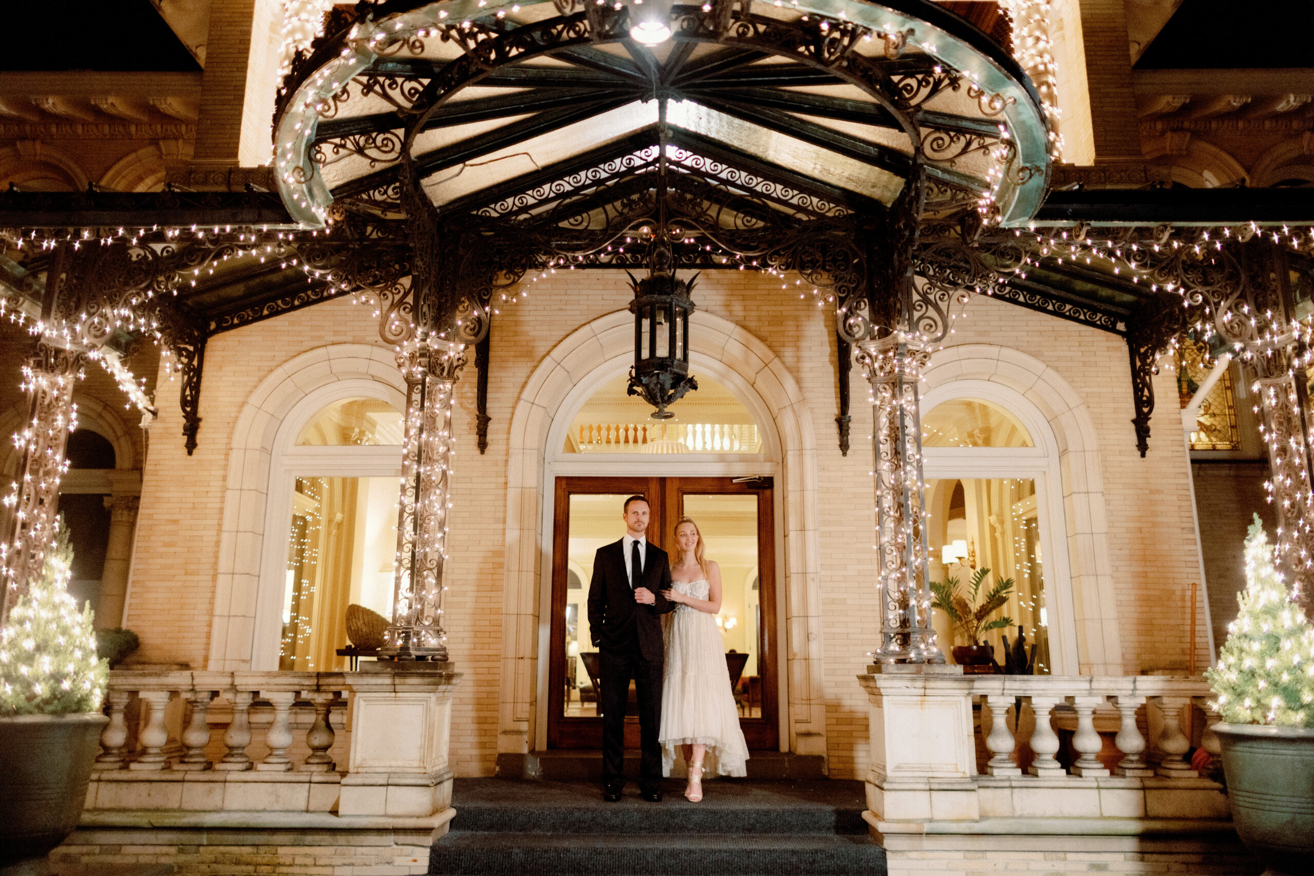 The couple is standing in front of the luxury wedding venue. Luxury wedding trends of 2023 image by Jenny Fu Studio