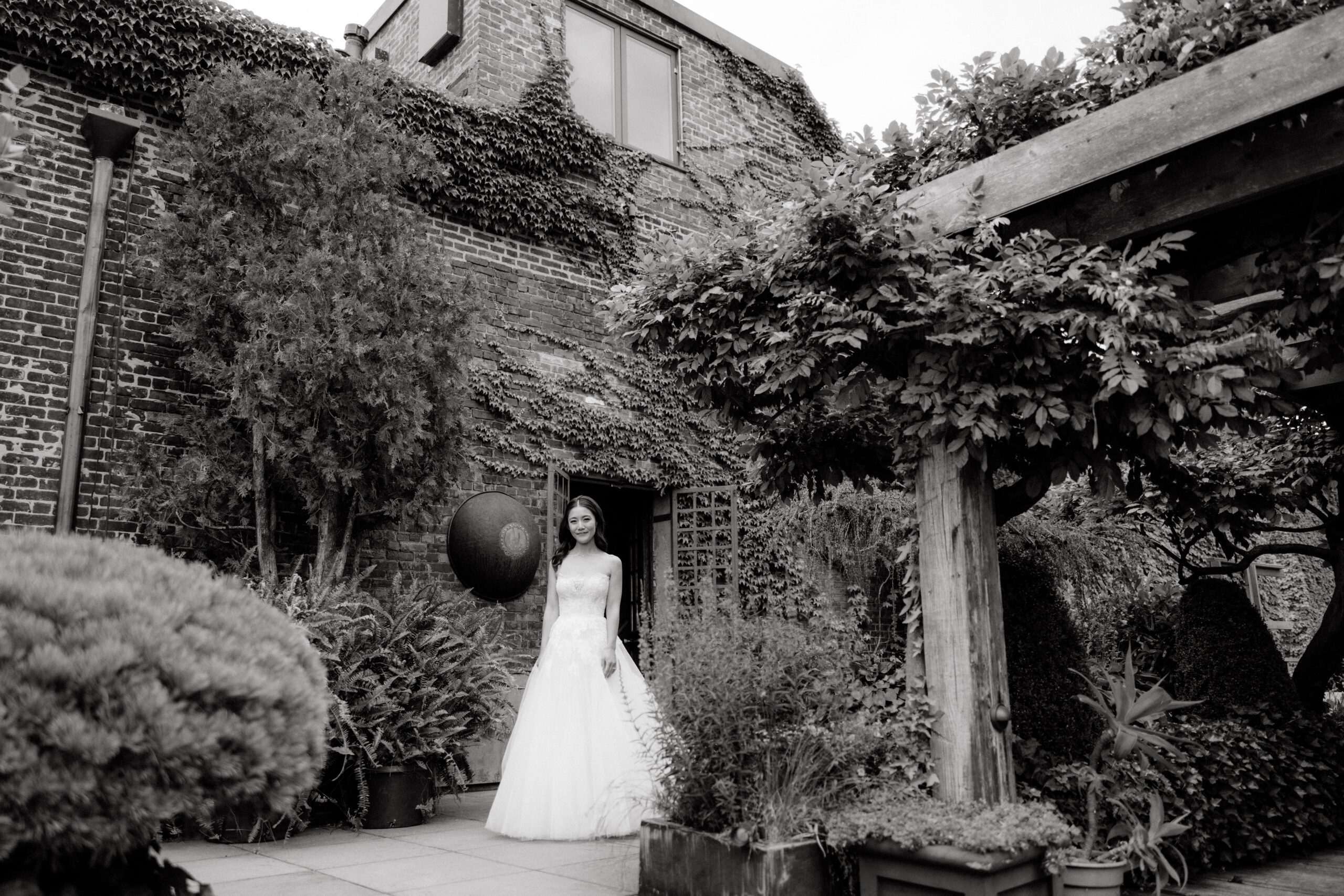 Black and white outdoor portrait of the bride. High-quality wedding photography image by Jenny Fu Studio.