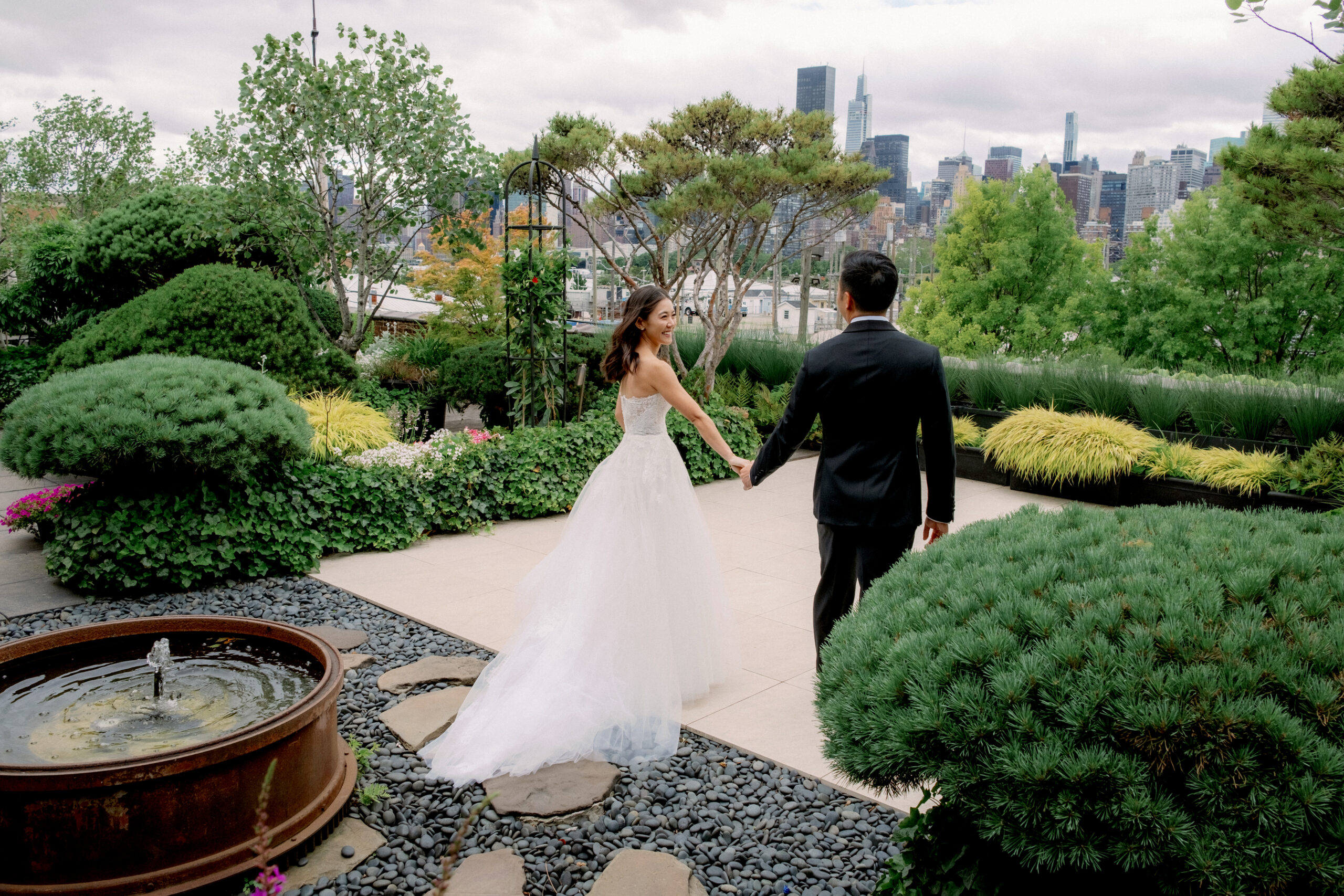 Newlyweds are walking in the spring outdoors.. Wedding photography Image by Jenny Fu Studio